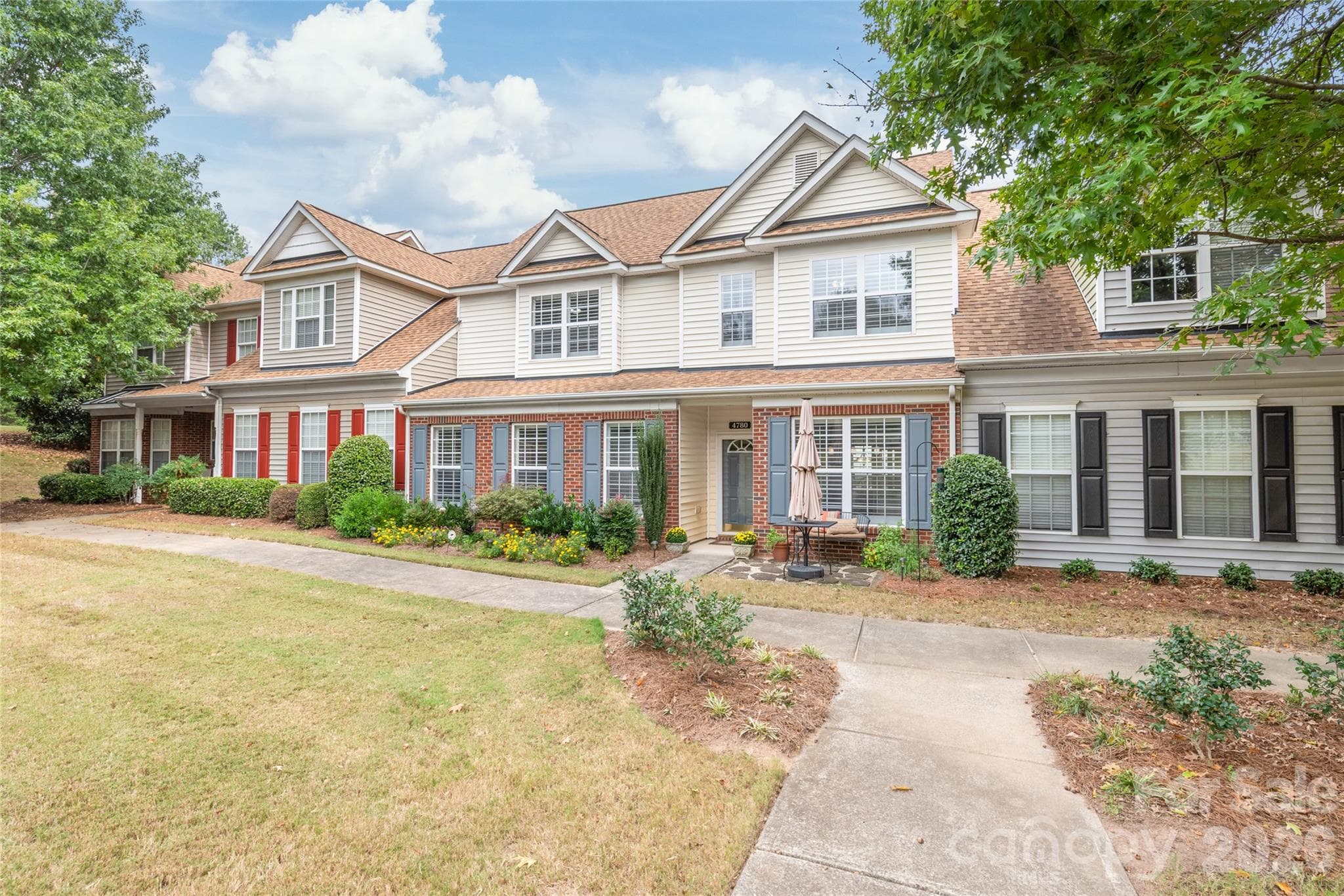 The best of both worlds! Enjoy the low-maintenance ease of townhome living combined with the space, layout that feels just like a single-family home. - 4780 Grier Farm Lane, Charlotte