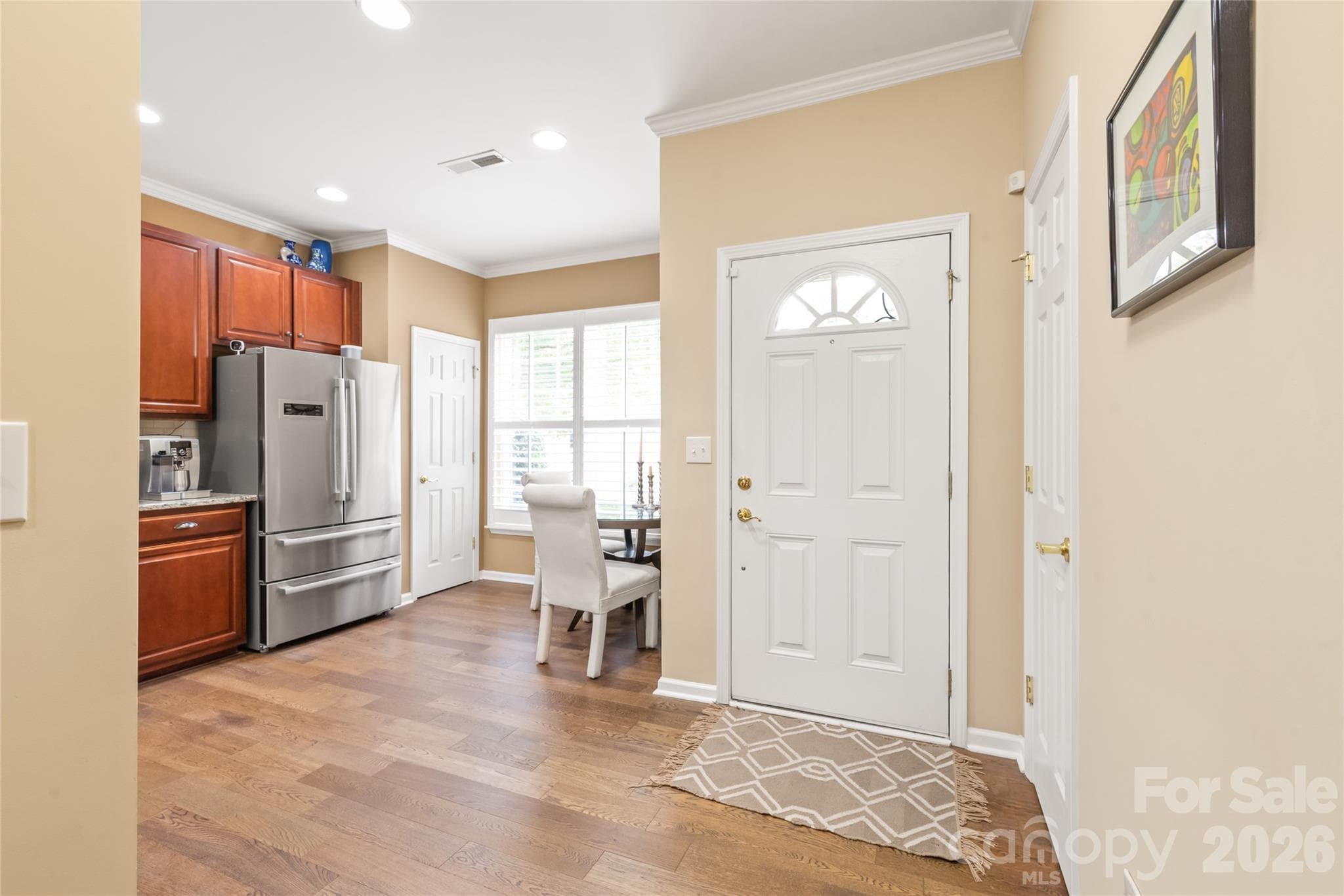 Step inside and enjoy the view! With a clear glass storm door, you can flood your entry with warm natural light. - 4780 Grier Farm Lane, Charlotte