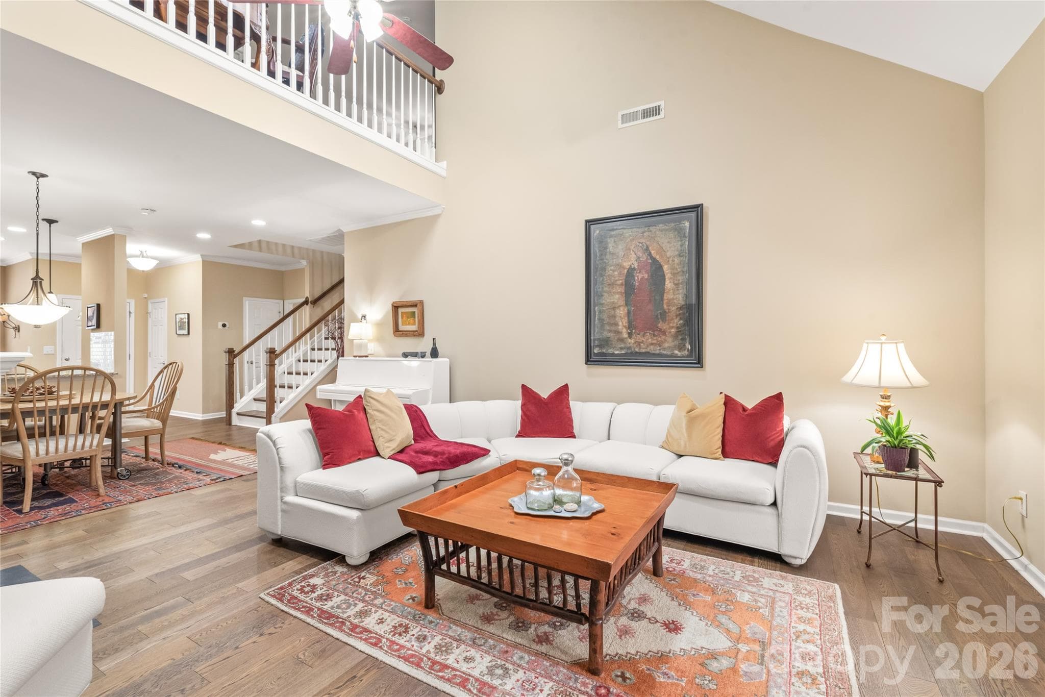 Open & Airy Living Room: Features impressive vaulted ceilings and updated skylights that flood the space with natural light. - 4780 Grier Farm Lane, Charlotte