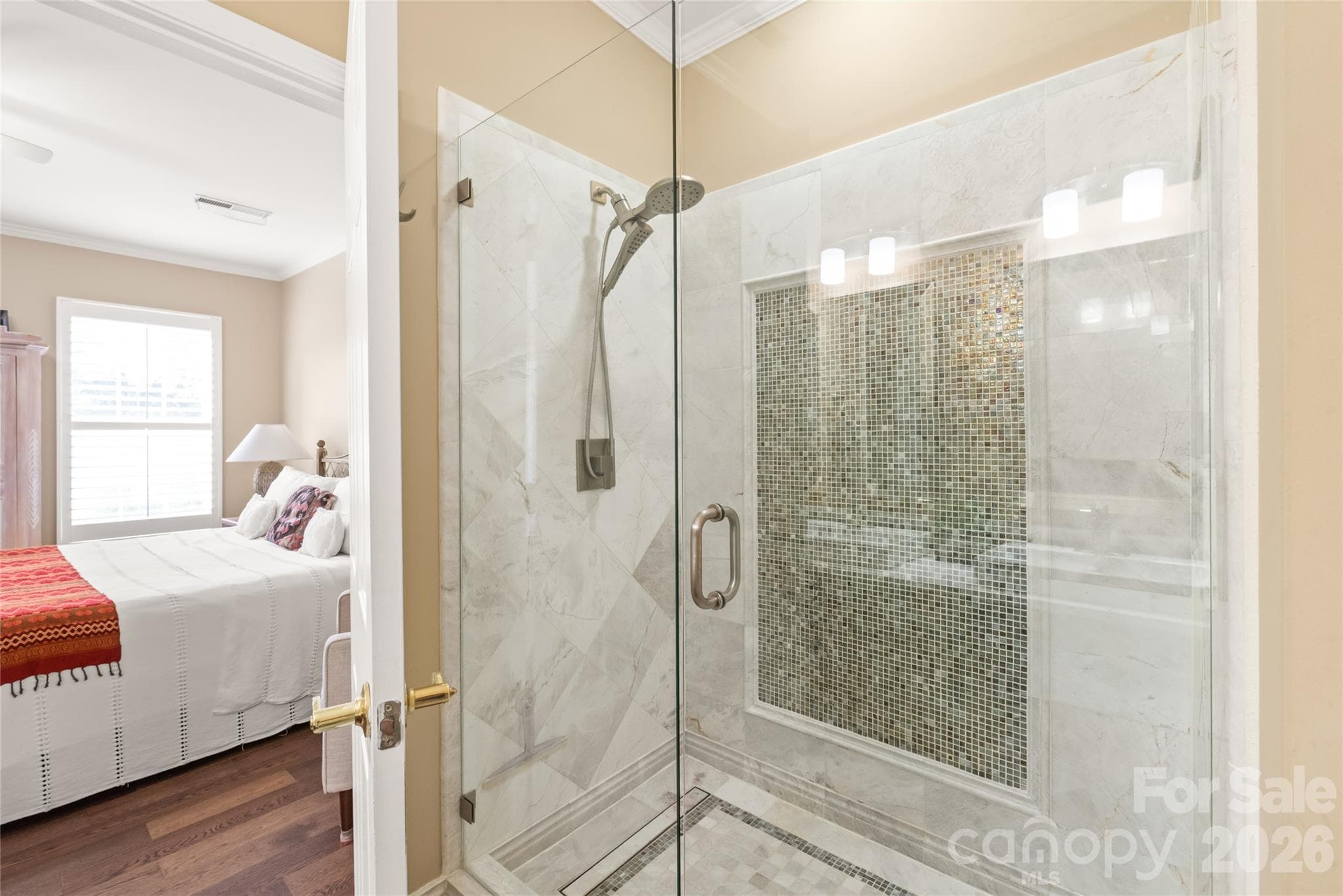 From the custom stone tile accent wall in the shower to the updated fixtures and high-efficiency toilet, no detail was spared. - 4780 Grier Farm Lane, Charlotte