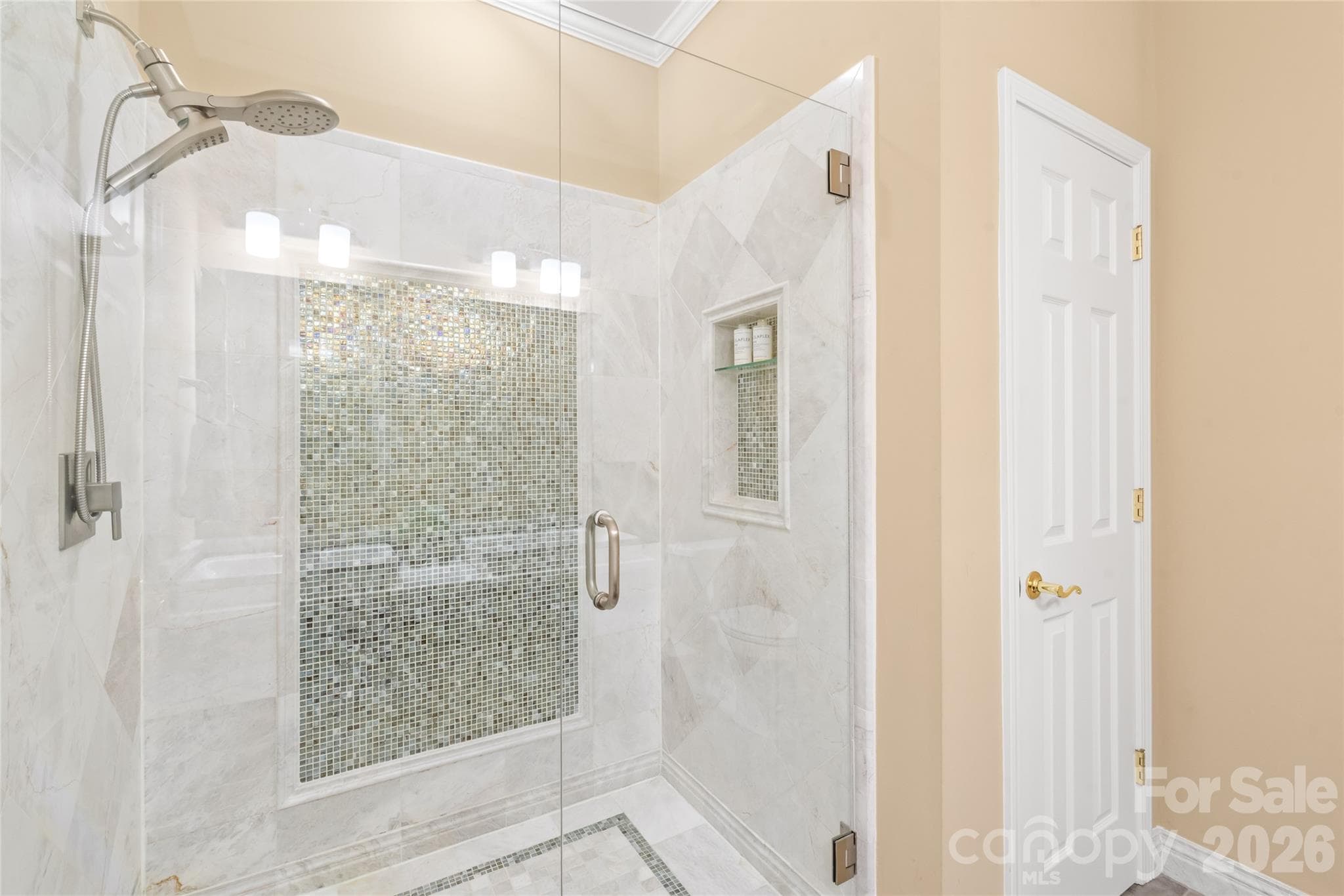 Bright, fresh, and beautifully appointed, this updated bathroom off the primary suite offers a clean, luxury experience right at home. - 4780 Grier Farm Lane, Charlotte