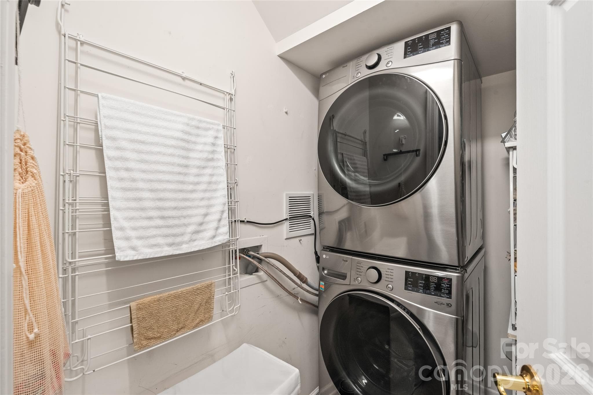 Laundry made easy! Enjoy the ultimate convenience of a dedicated main-floor walk-in laundry room, complete with tile flooring and plenty of space to keep household tasks organized and out of sight. - 4780 Grier Farm Lane, Charlotte