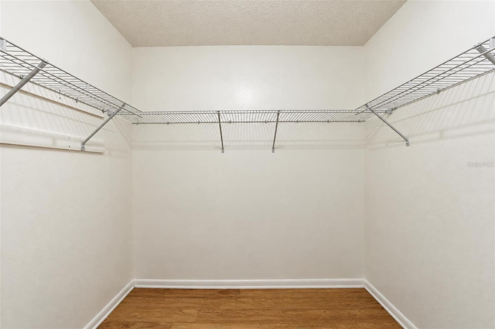 Primary walk-in closet - 302 LOTUS AVE, SEBRING