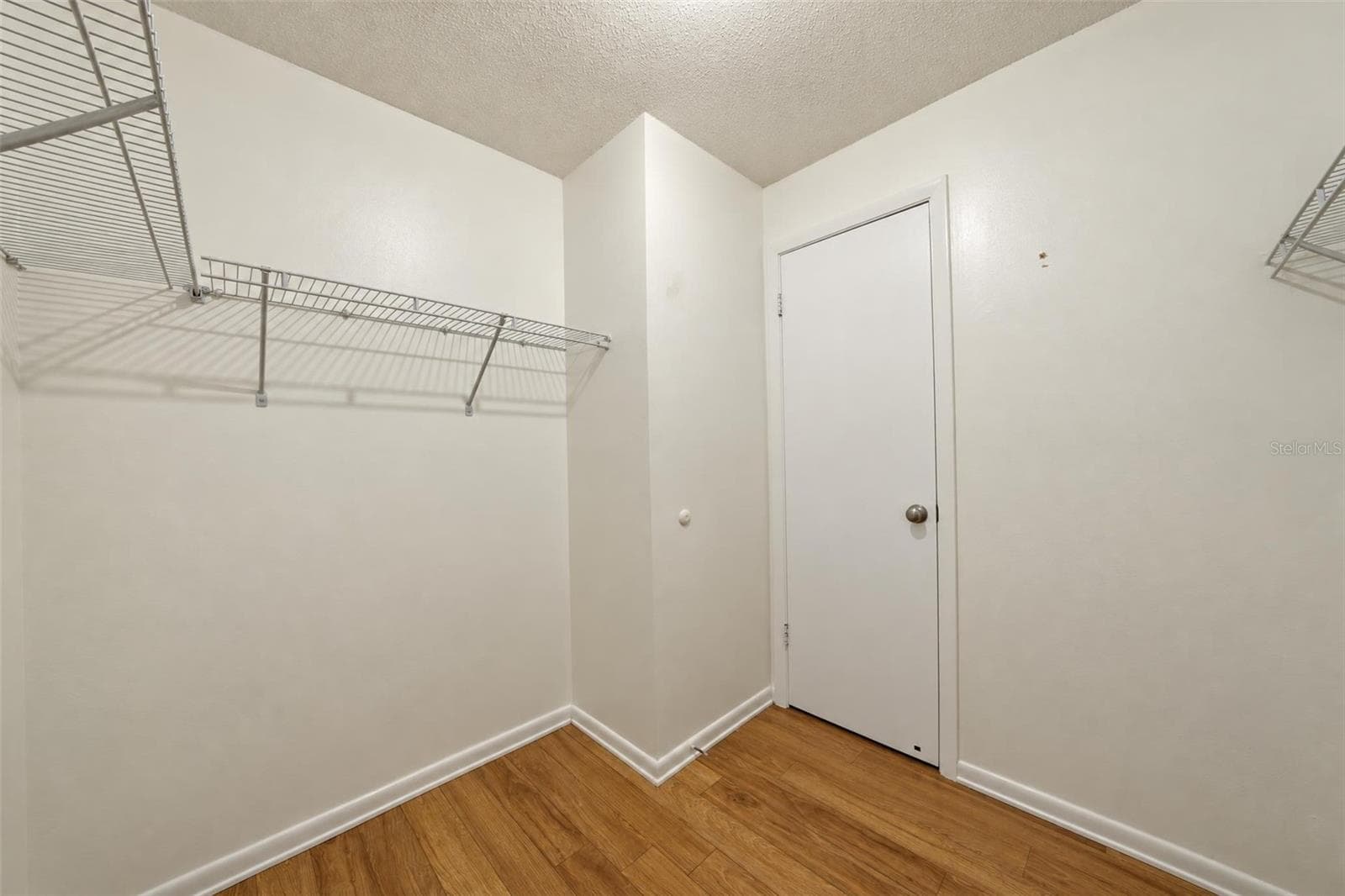 Primary walk-in closet - 302 LOTUS AVE, SEBRING