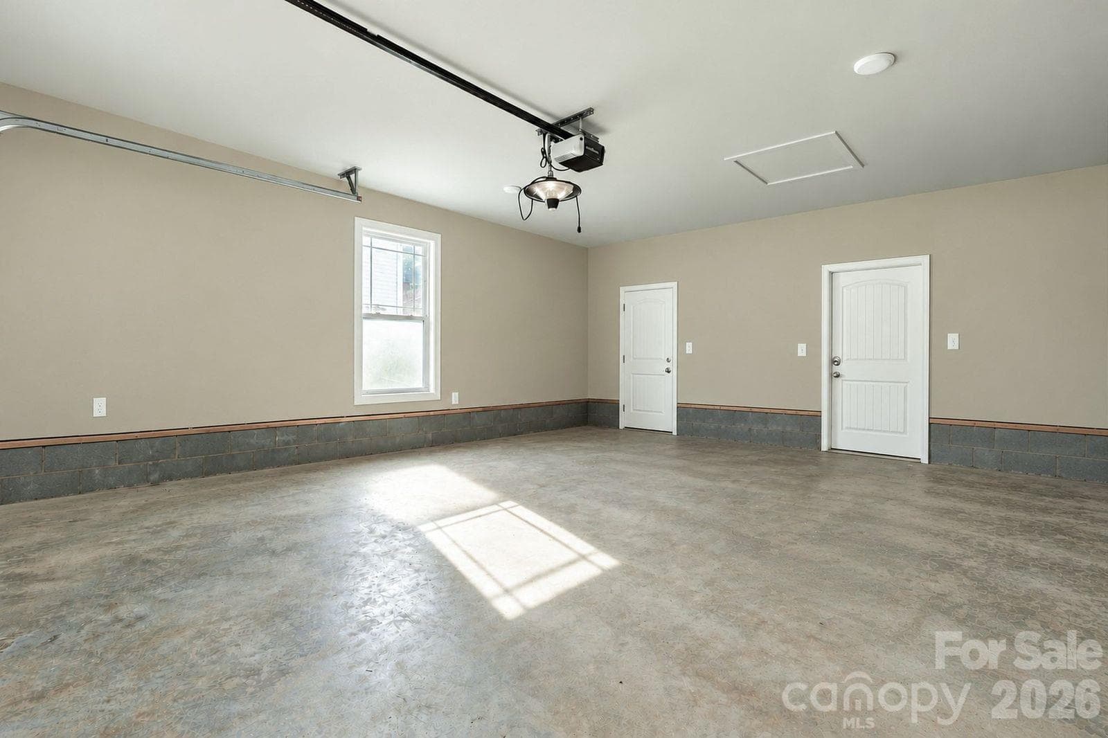 Garage has a walk in storage space on left and enterance to laundry on right - 1544 Farmington Hills Drive, Conover