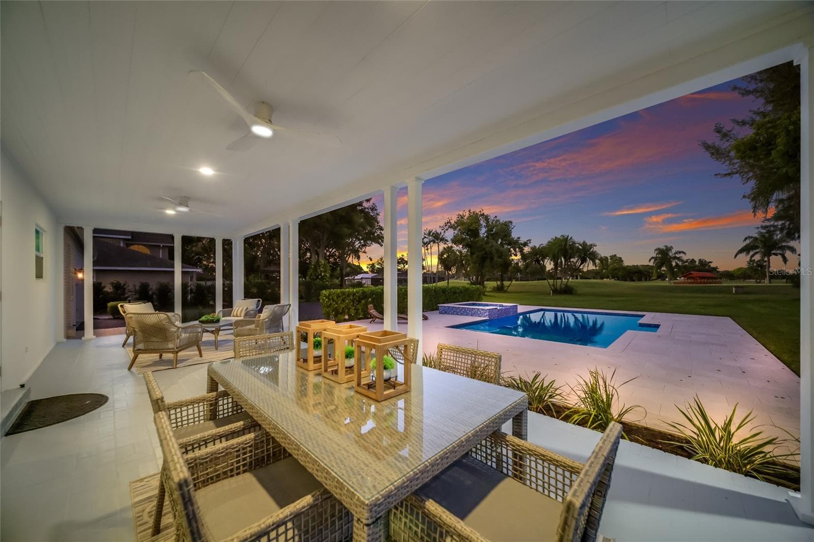 Back porch overlooks the pool and golf course. - 5060 18TH AVE W, BRADENTON