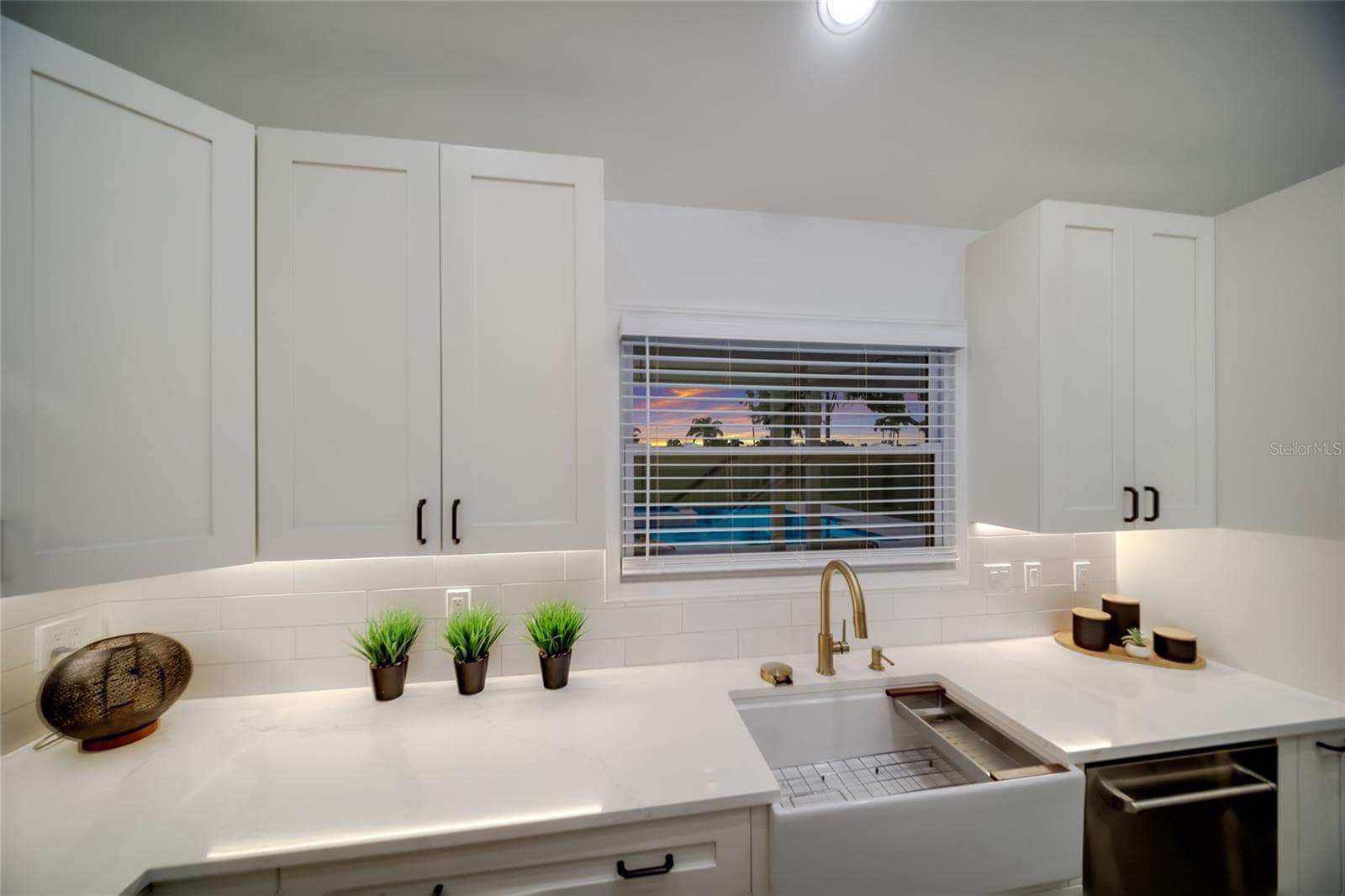 Deep farmhouse sink beneath the window. - 5060 18TH AVE W, BRADENTON