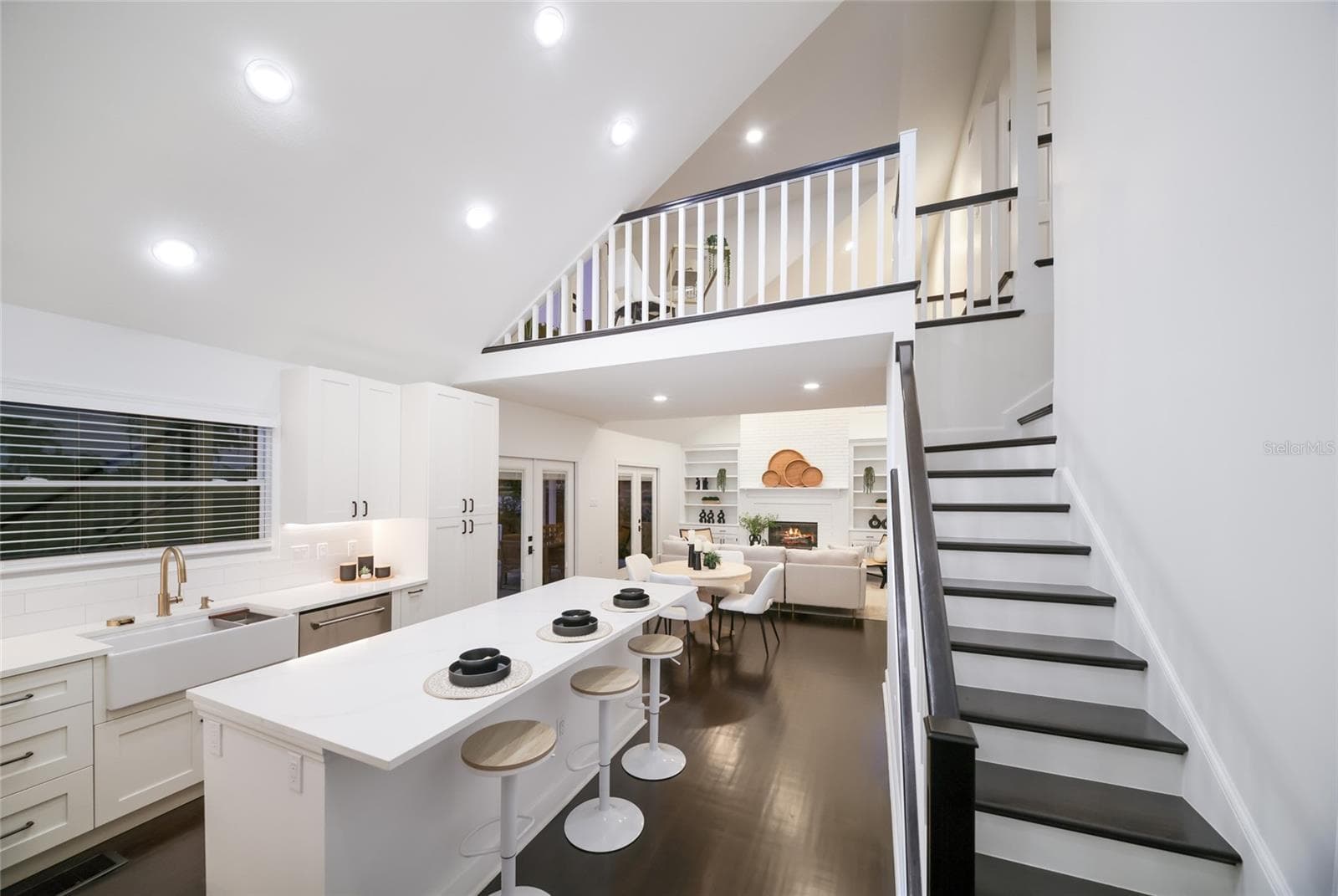 Access to the upstairs loft, deck, and addtional bedrooms off the kitchen. - 5060 18TH AVE W, BRADENTON