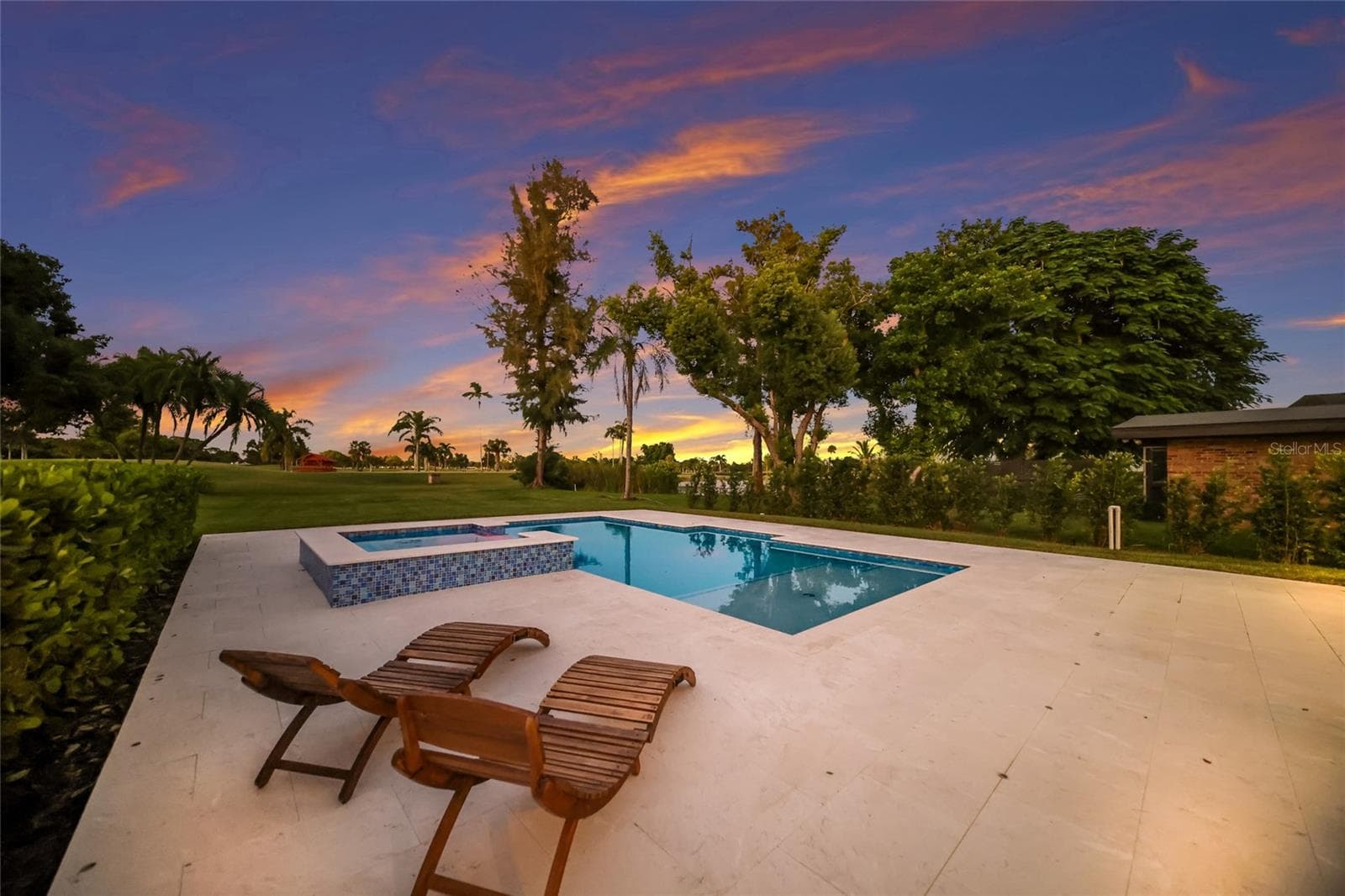 Plenty of deck space around the pool and spa - 5060 18TH AVE W, BRADENTON