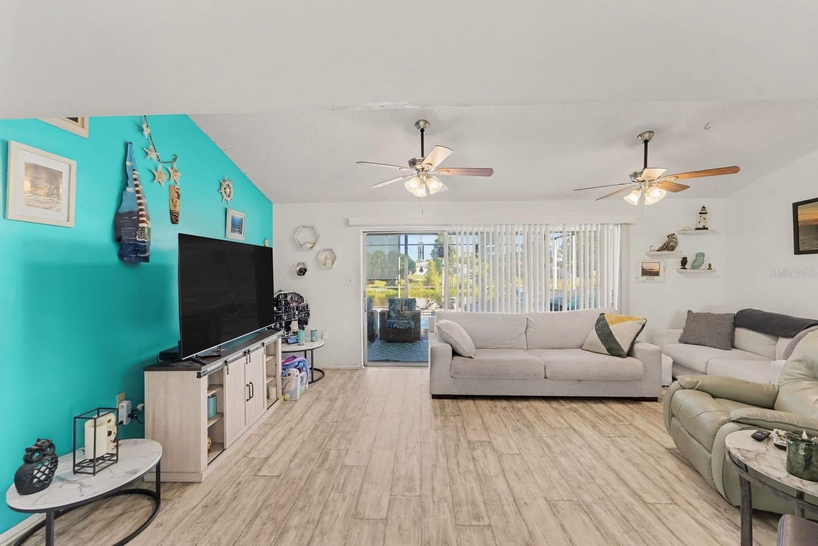 Expansive living space with multiple seating areas and water views - 8431 REDFIELD DR, PORT RICHEY