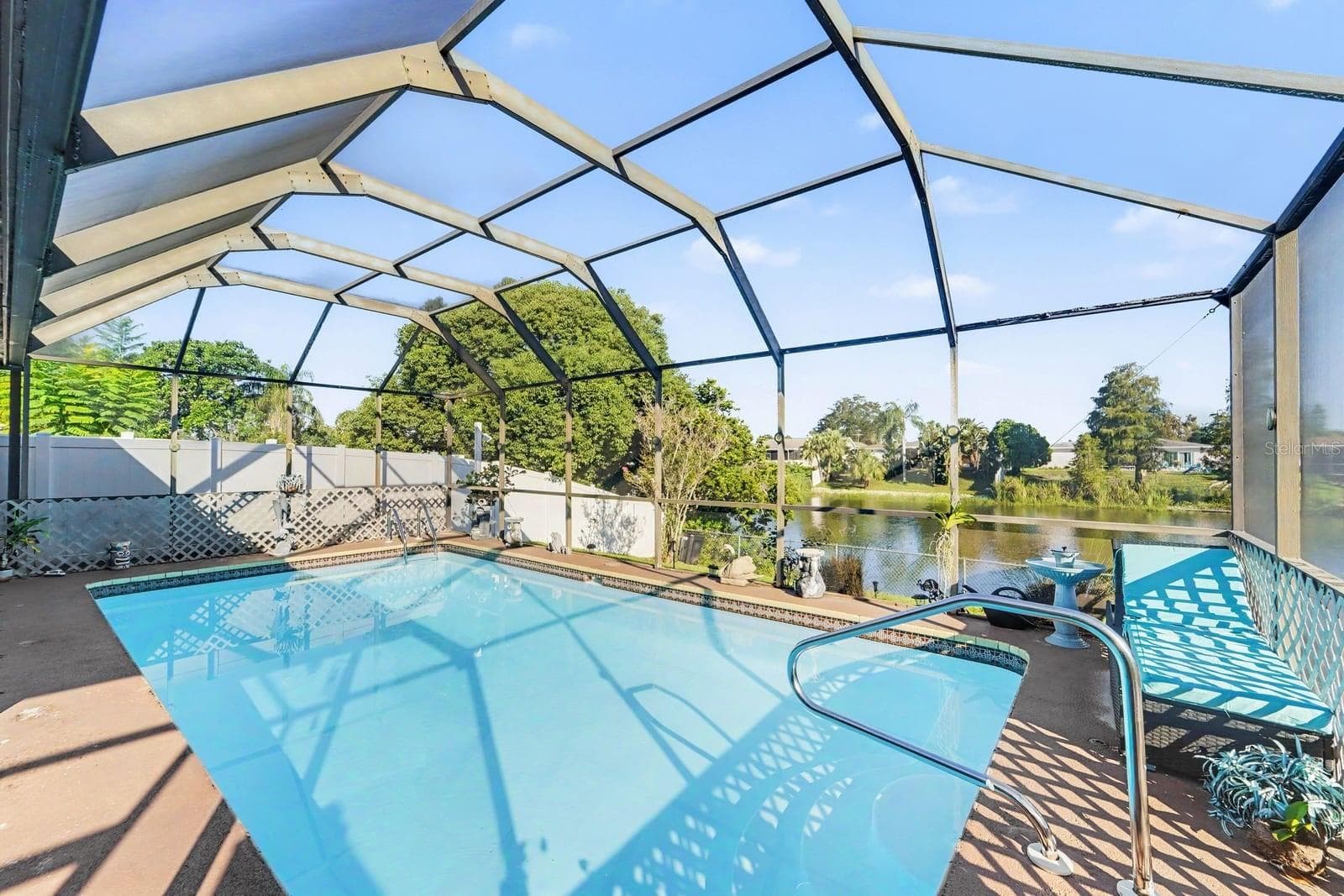 Resort-Style Screened Pool with Arched Enclosure & Waterfront Views - 8431 REDFIELD DR, PORT RICHEY