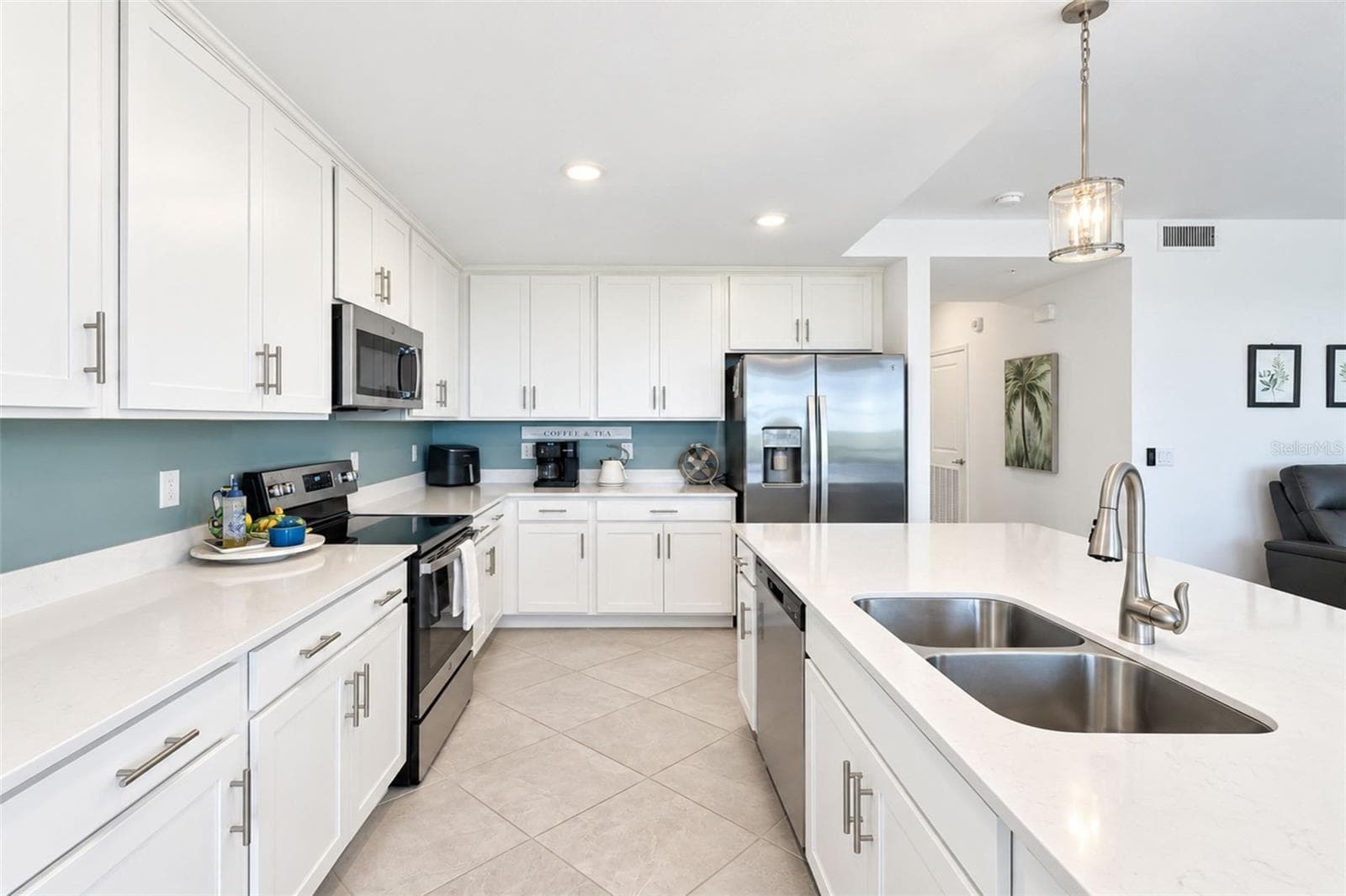 Kitchen Aisle - 14161 HERITAGE LANDING BLVD #1132, PUNTA GORDA