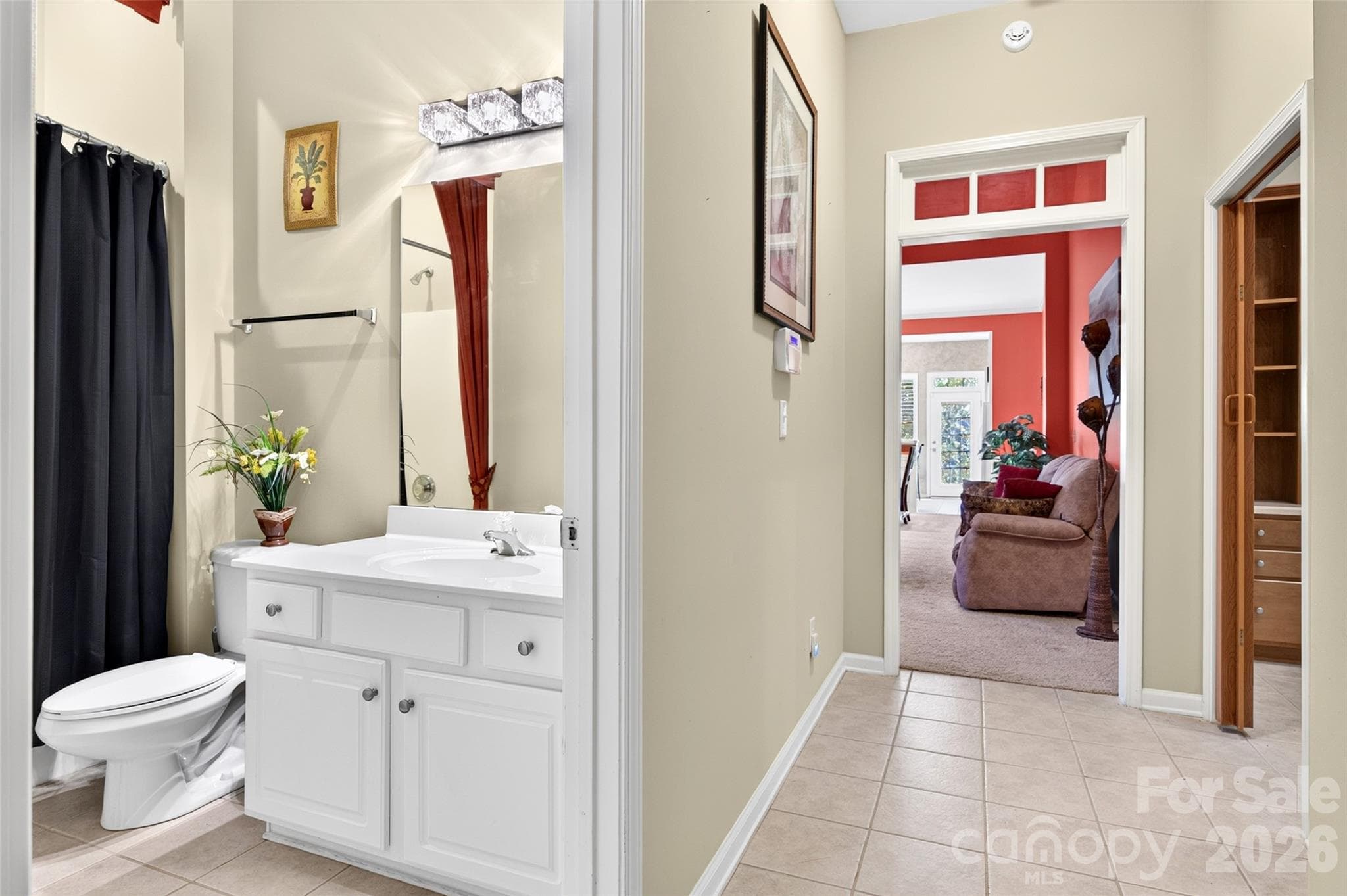 The hallway has tile flooring. - 8432 Brookings Drive, Charlotte