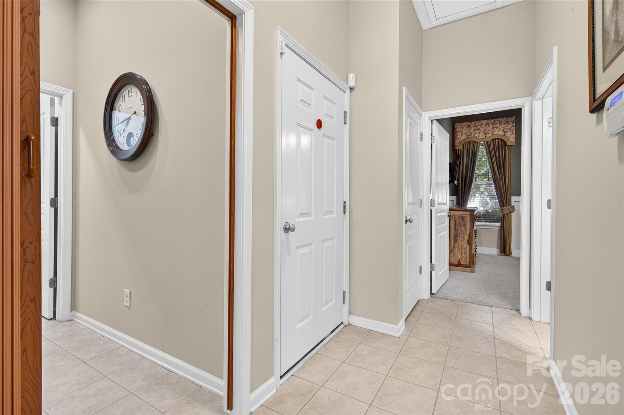 Hallway with tile flooring. - 8432 Brookings Drive, Charlotte