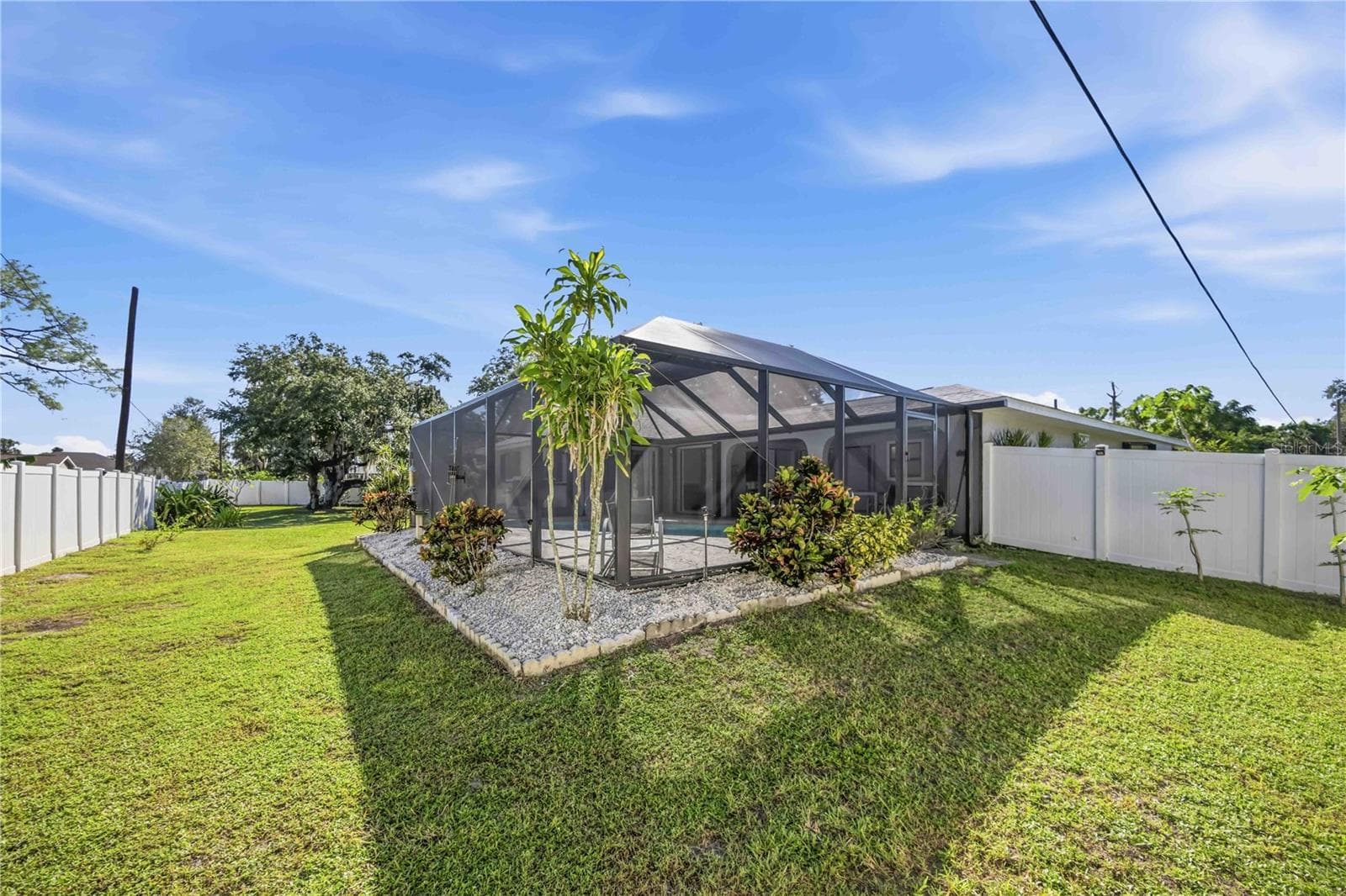 Fenced backyard with palm trees - 21012 CHURON AVE, PORT CHARLOTTE