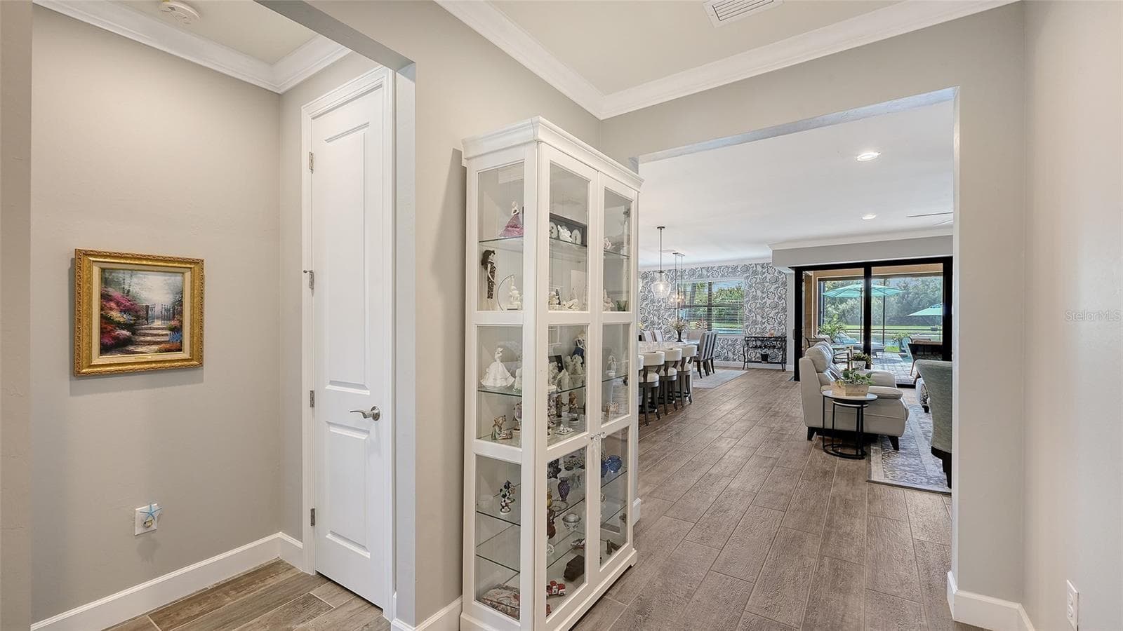 A gracious entrance welcomes you into this exceptional home, setting the tone for the inviting spaces that await within. - 6827 GOSPORT CV, BRADENTON