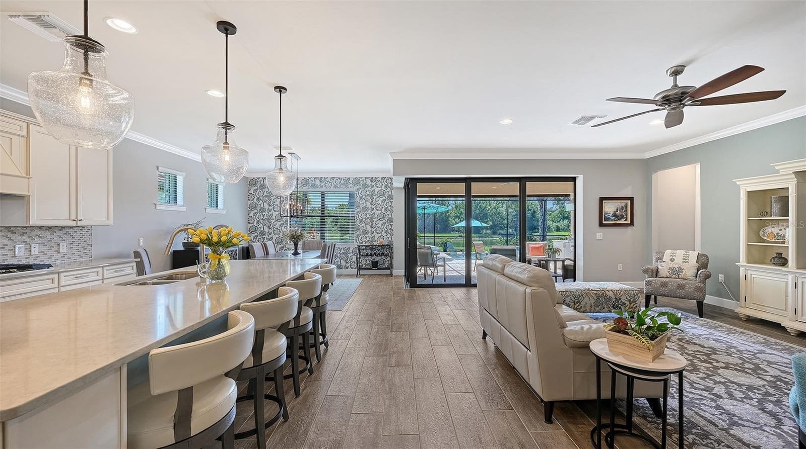 Step inside to discover an inviting great room and stunning kitchen gathering area, thoughtfully designed for everyday comfort and effortless entertaining. - 6827 GOSPORT CV, BRADENTON