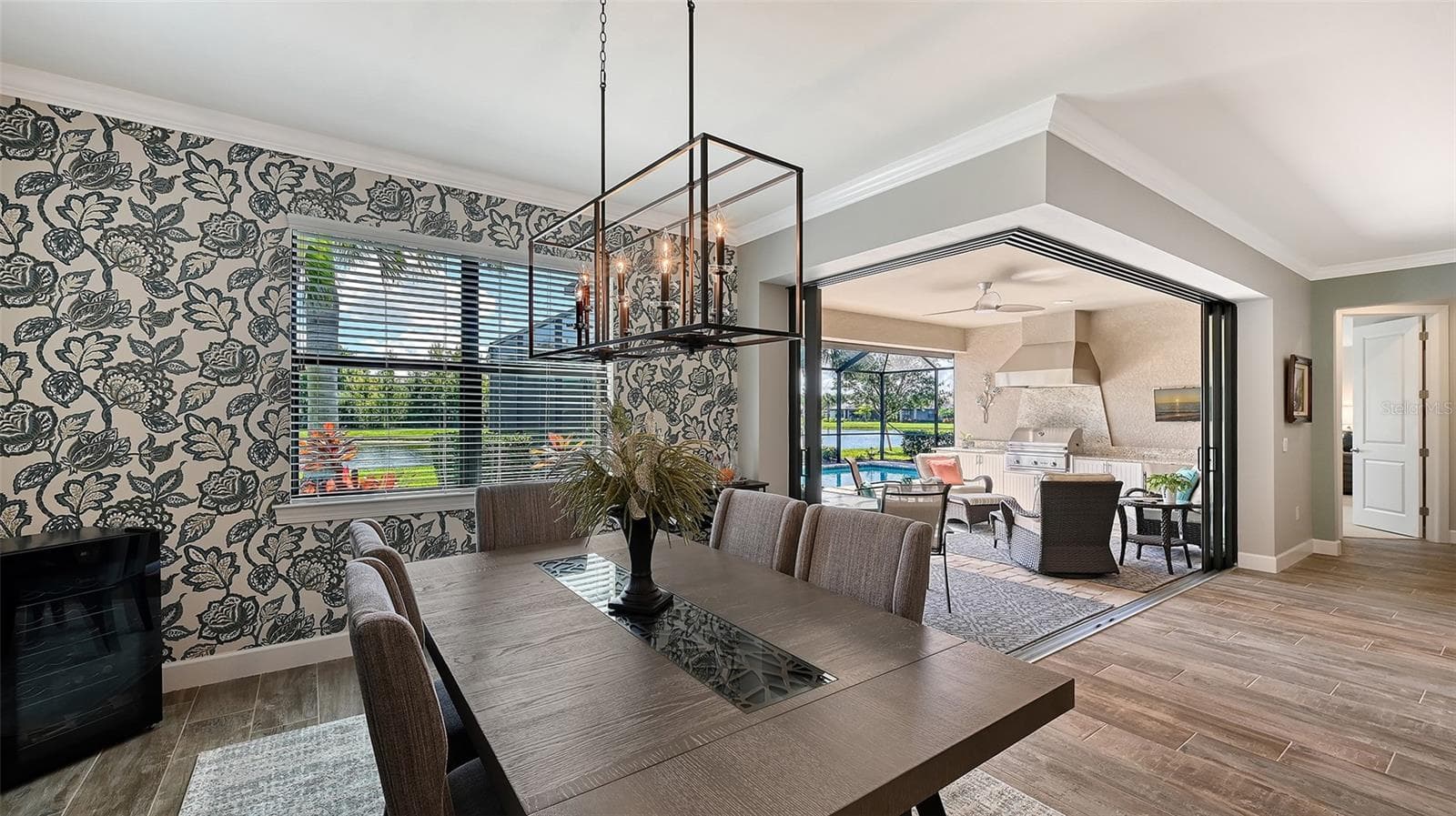 Fully pocking zero-corner sliders disappear to unveil an imppressive lanai. - 6827 GOSPORT CV, BRADENTON