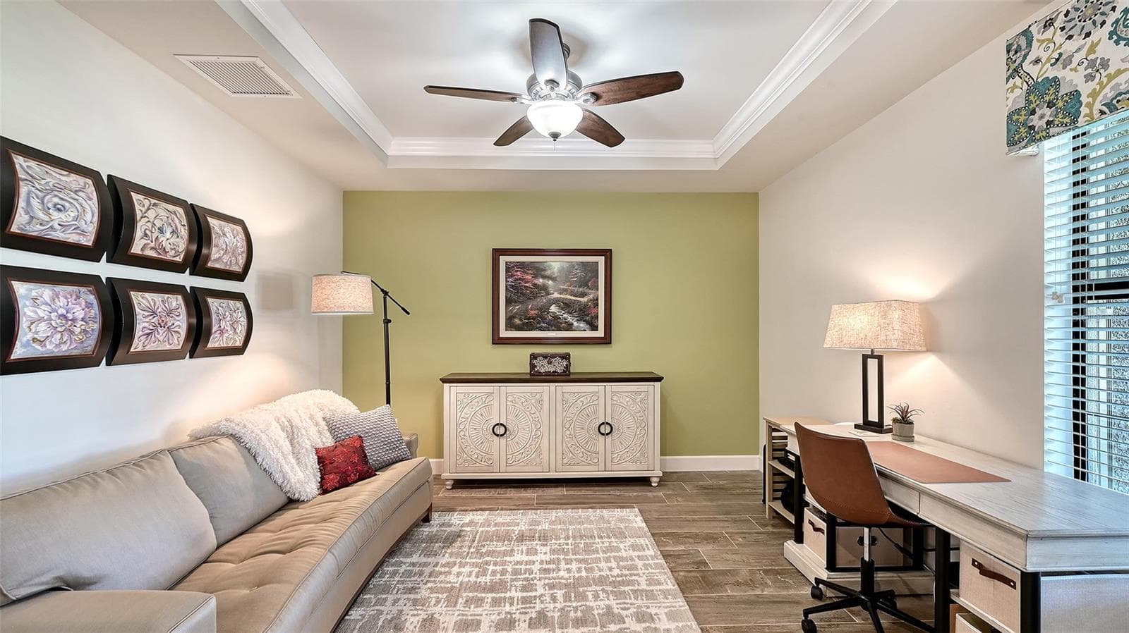 Study/Den in the front of the home with a tray ceiling gives you privacy to work from home or enjoy this room as a den. - 6827 GOSPORT CV, BRADENTON