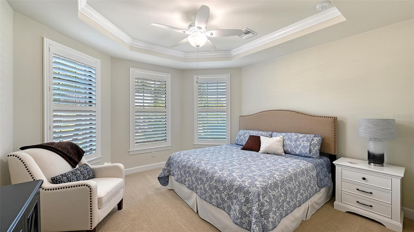 Seconday bedroom located in the front of the home featuring a large walk-in closet. - 6827 GOSPORT CV, BRADENTON