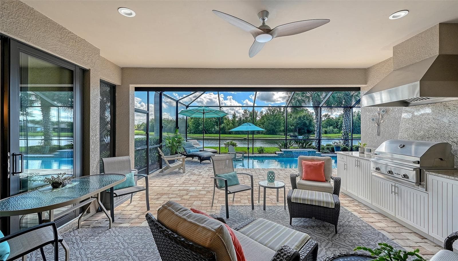 Where luxury living meets outdoor living with an appointed outdoor kithchen, propane grill and a beverage refrigerator for your convenience. - 6827 GOSPORT CV, BRADENTON