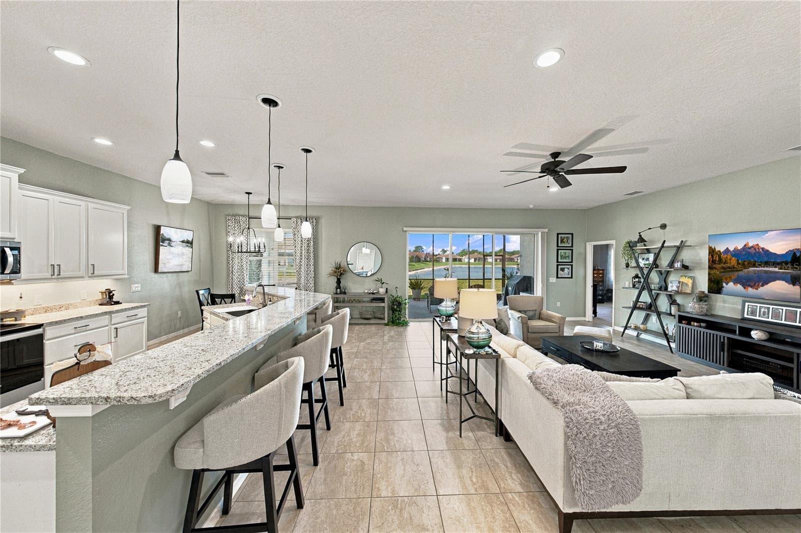 Kitchen bar & Living room - 6125 PEBBLE BEACH BLVD, WINTER HAVEN