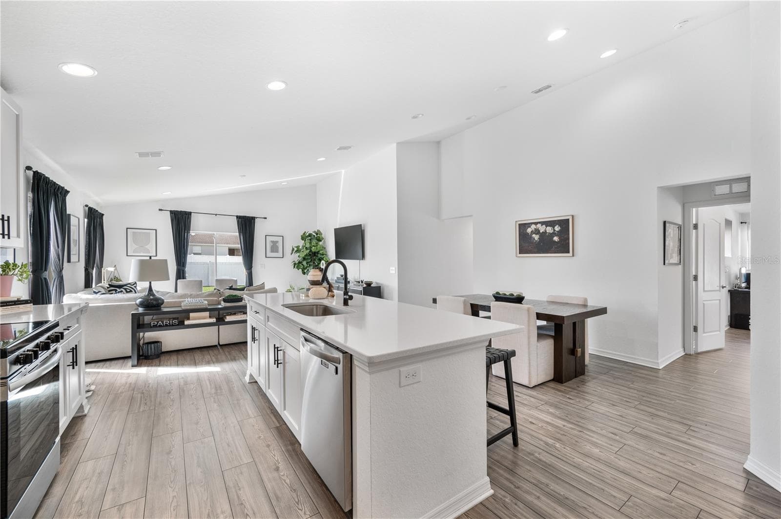 This view features the entry to the Primary Suite & en-suite bathroom - 1279 PINTAIL PL, LAKELAND