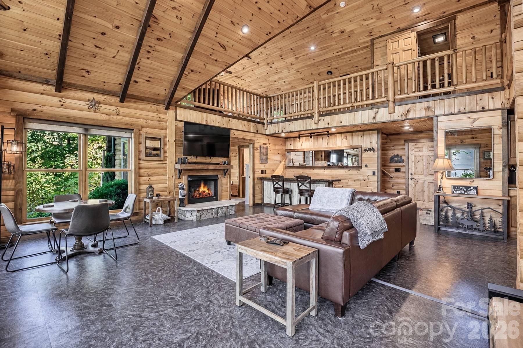 Great room toward the fireplace and open loft above - 18 Fairway Run, Bryson City