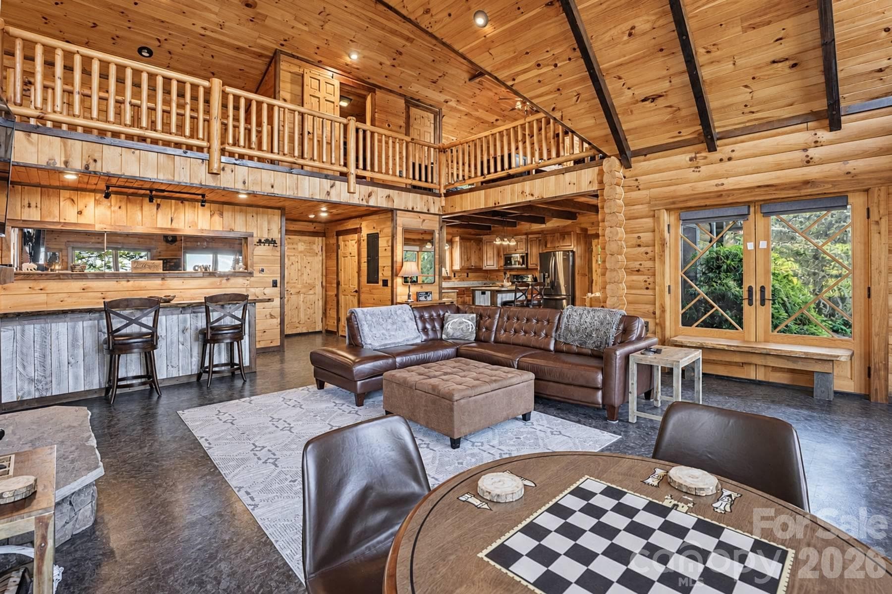 Living area with game table and breakfast bar - 18 Fairway Run, Bryson City