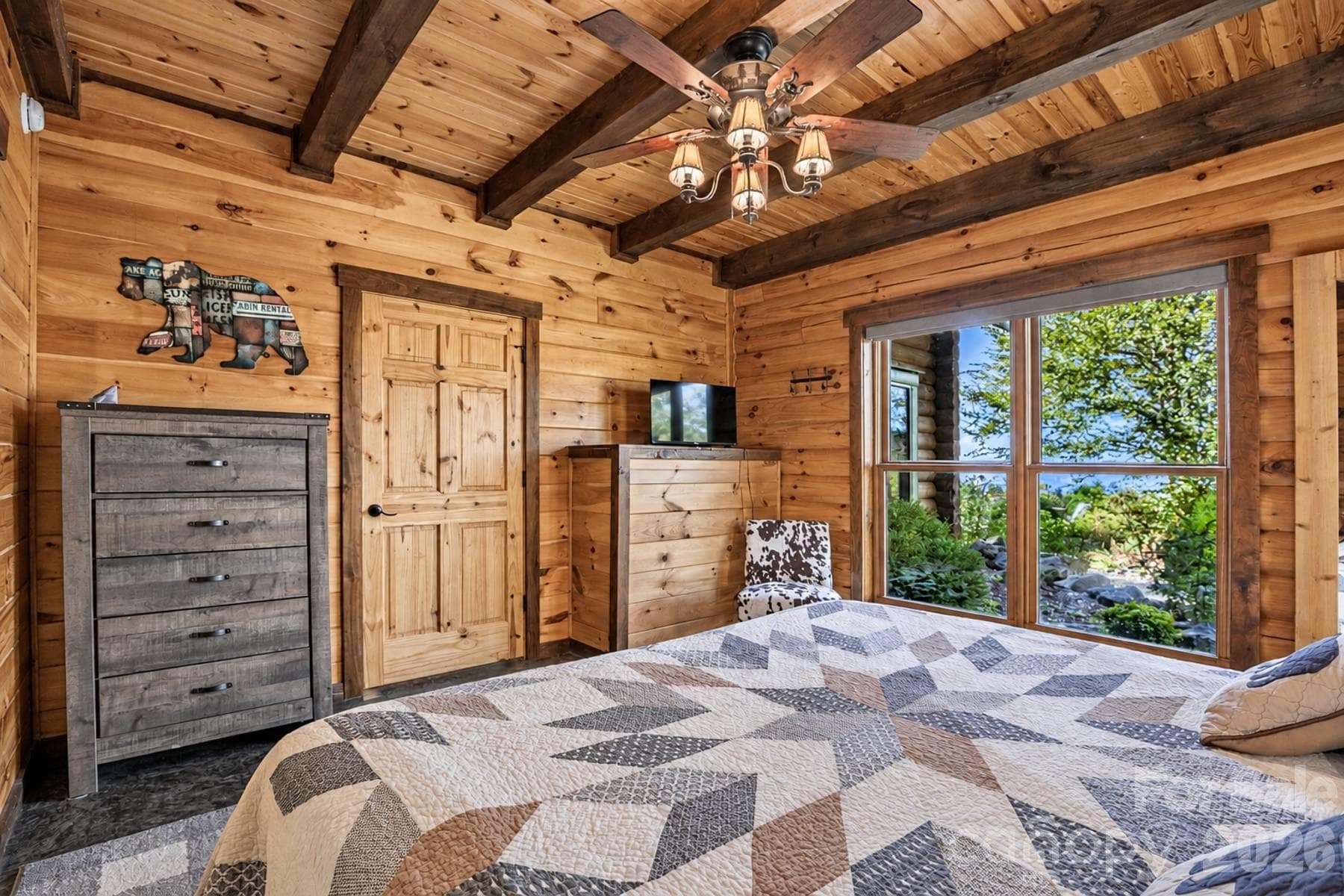 Primary bedroom with wooded view - 18 Fairway Run, Bryson City