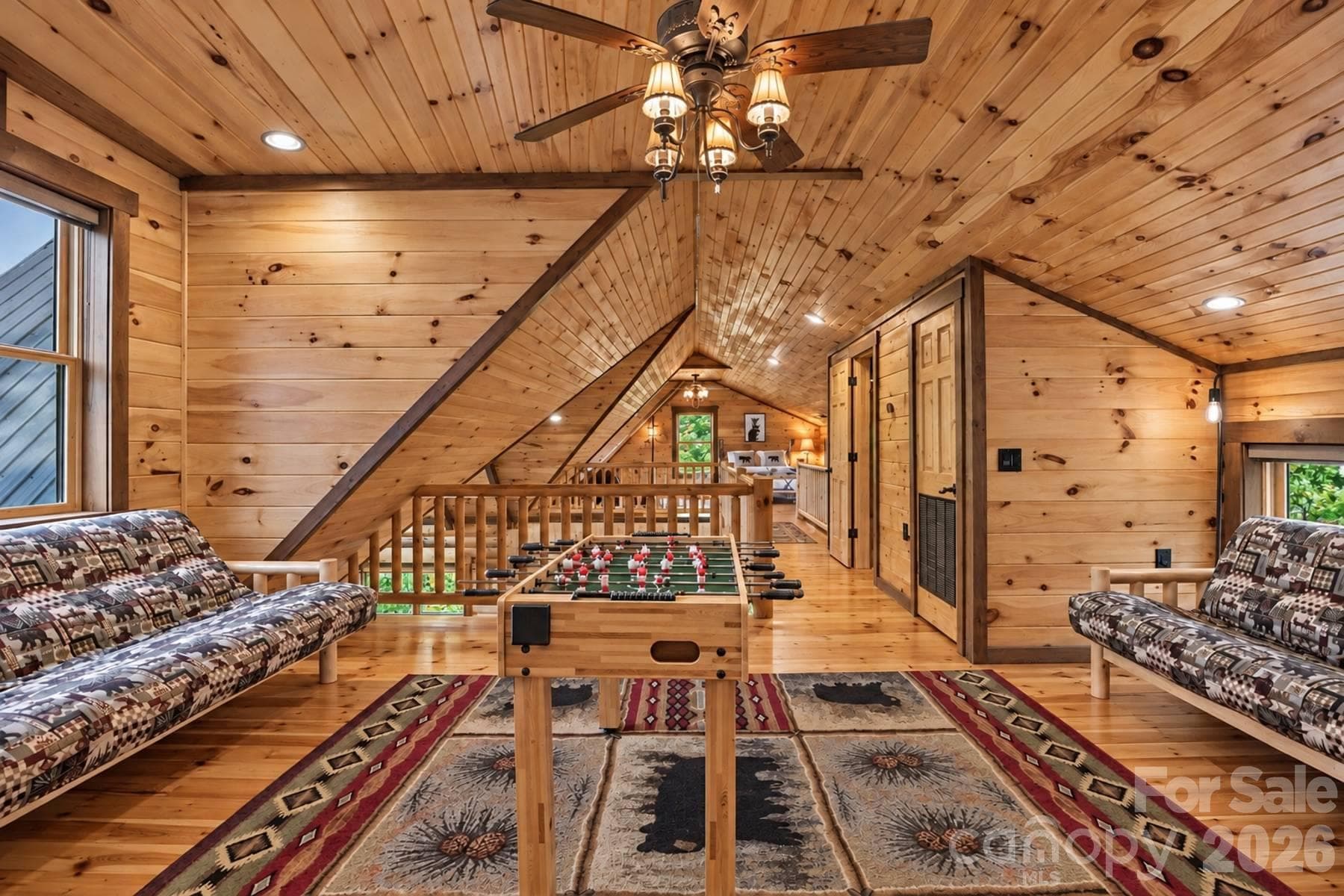 Game loft with foosball and seating - 18 Fairway Run, Bryson City
