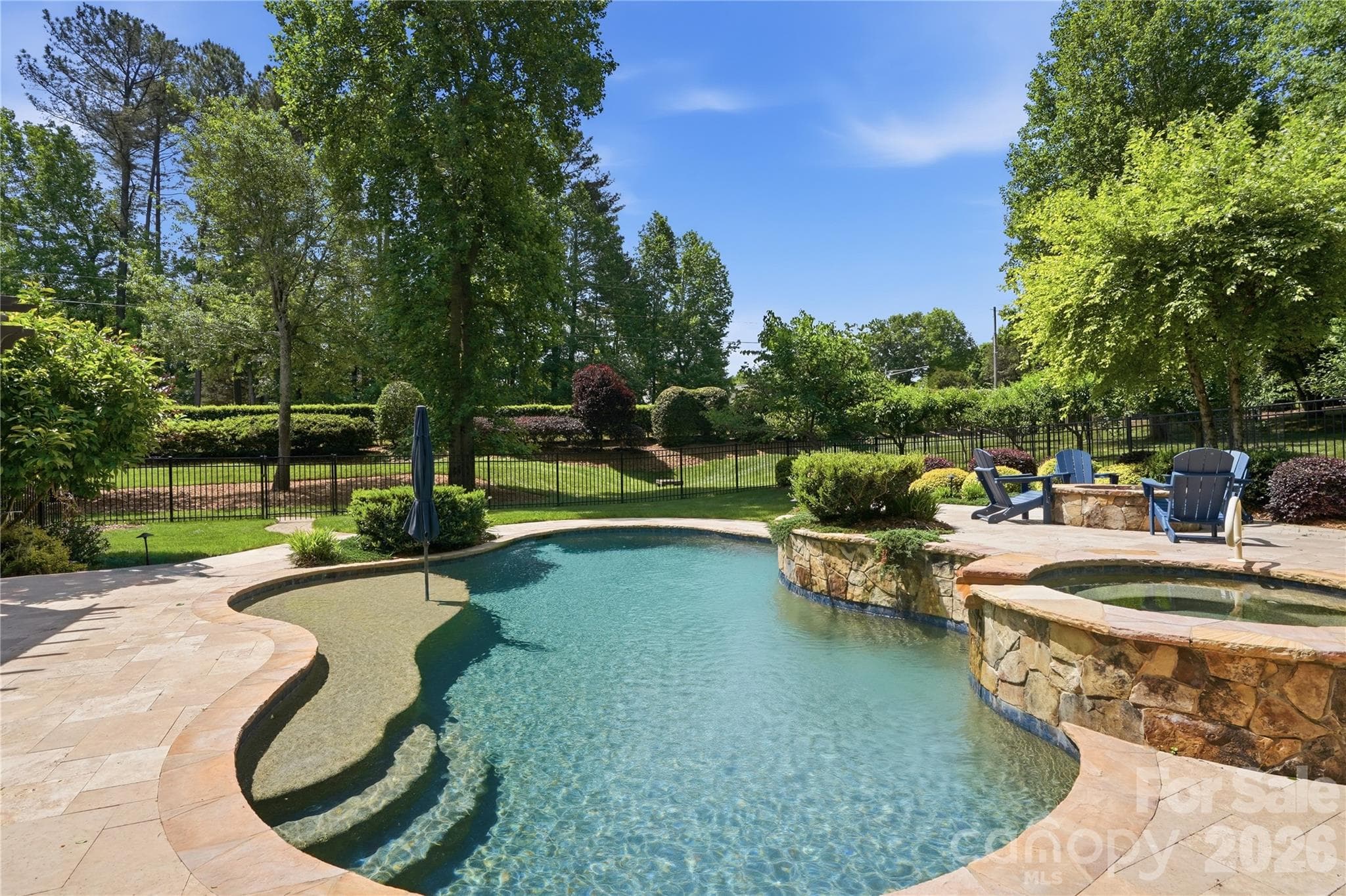 Pebble Tech, heated, saltwater pool and spa with sun deck, 3 waterfalls and ample patio space - 13632 Castleford Drive, Mint Hill