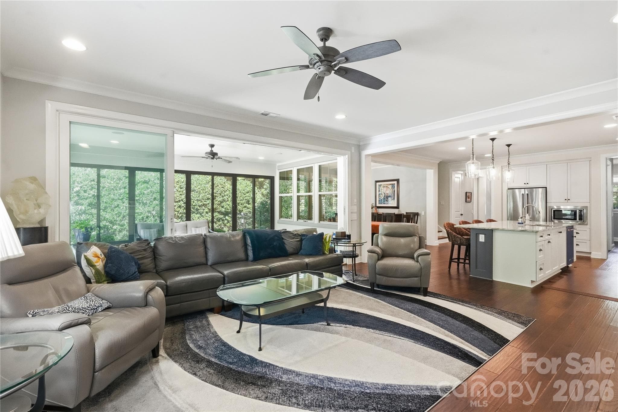 open floor plan with sunroom, great room, dining room and kitchen all centrally located - 13632 Castleford Drive, Mint Hill