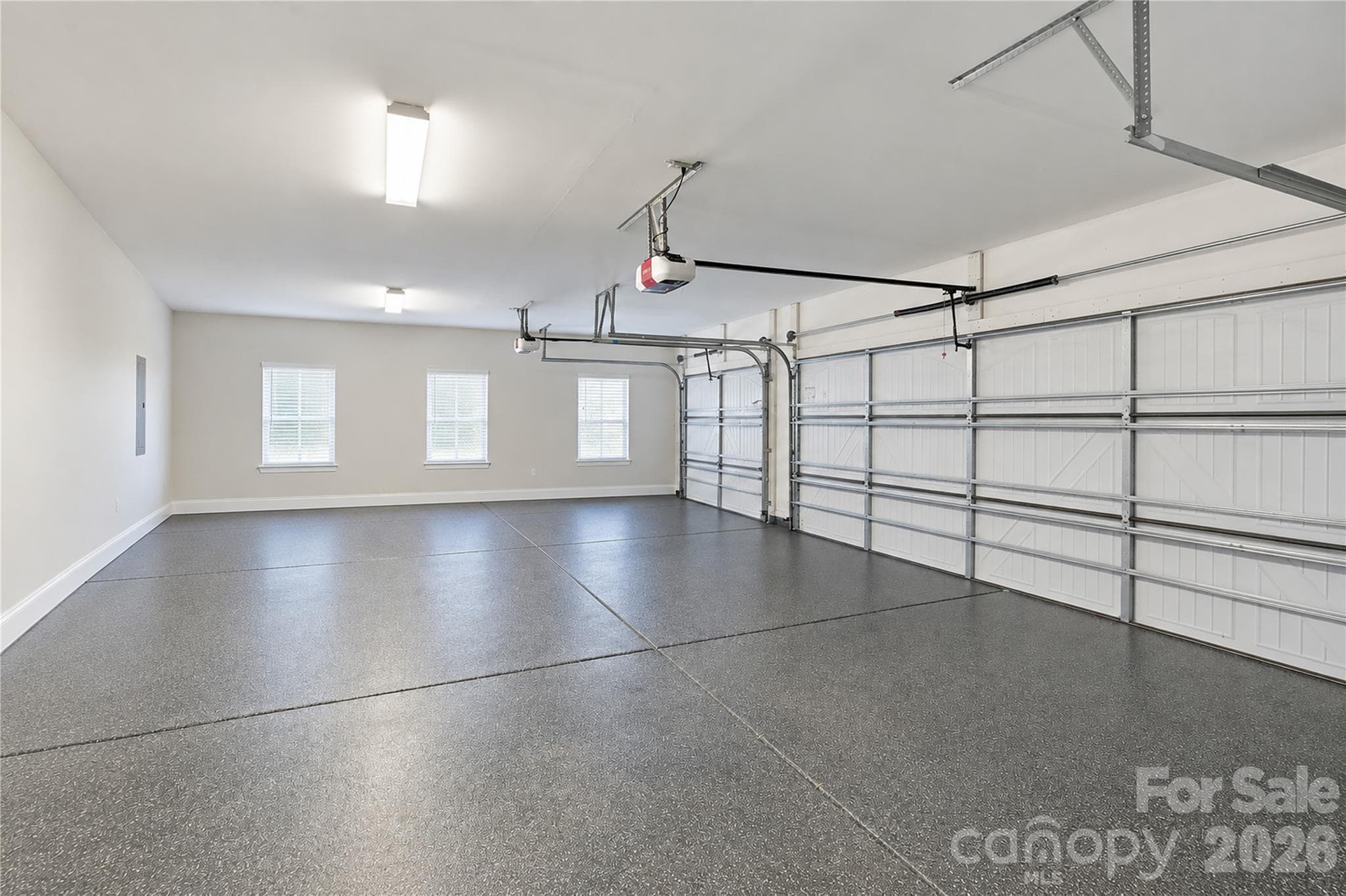 3 car garage - virtually enhanced to show empty - 13632 Castleford Drive, Mint Hill