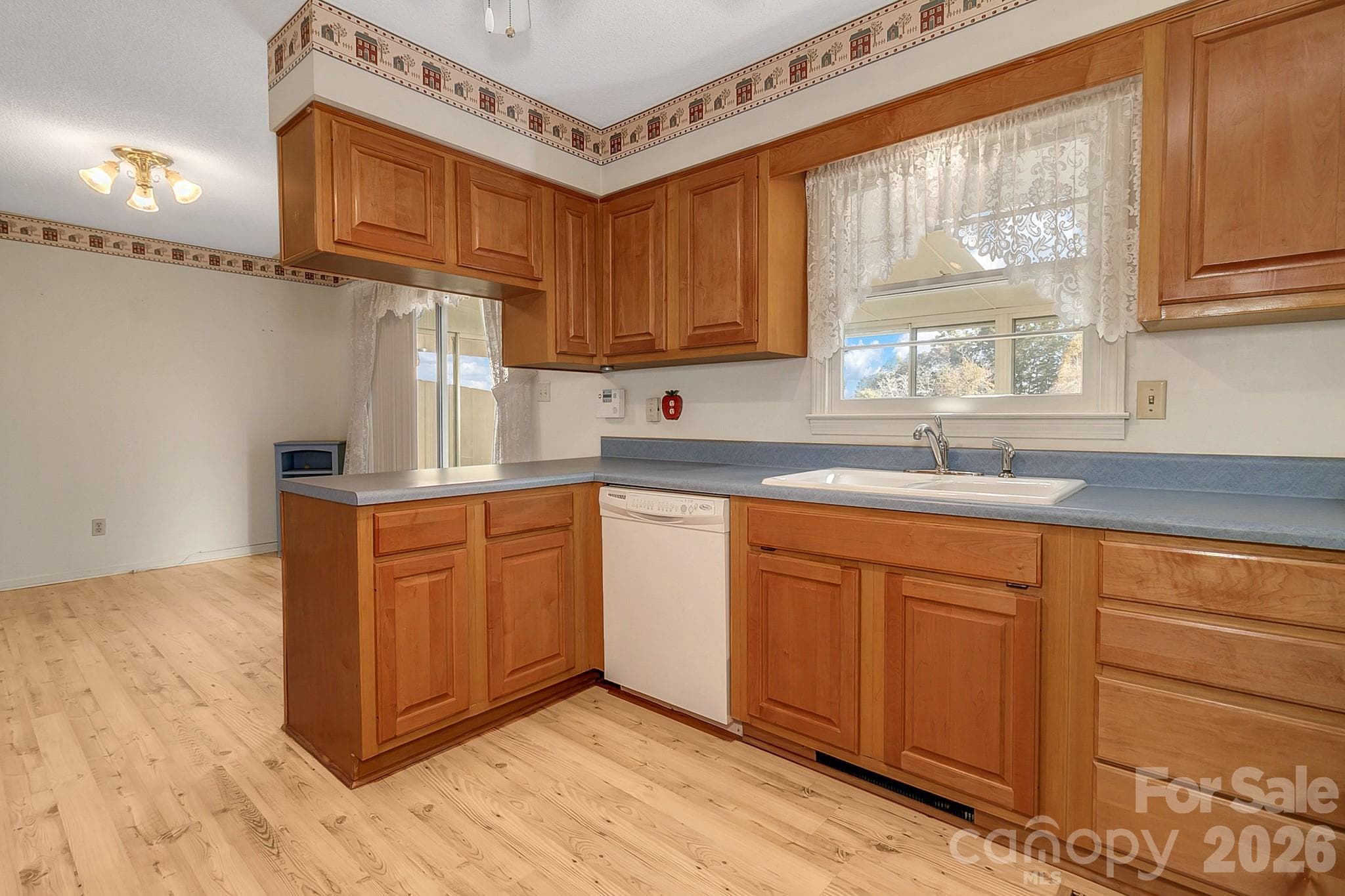 Kitchen w/window over sink & looking into dining area - 1 Dewberry Lane, Hendersonville