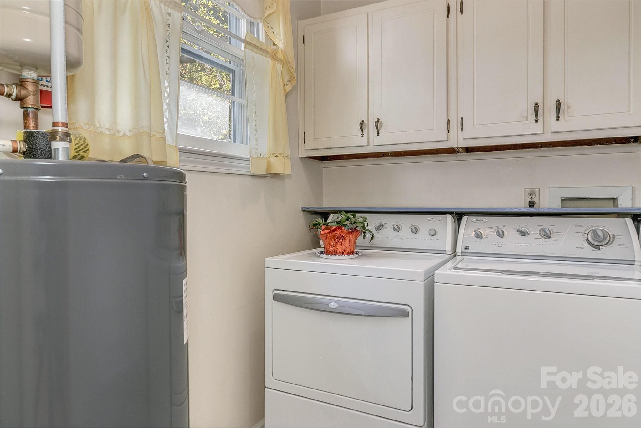 Laundry room w/cabinets & natural light - 1 Dewberry Lane, Hendersonville