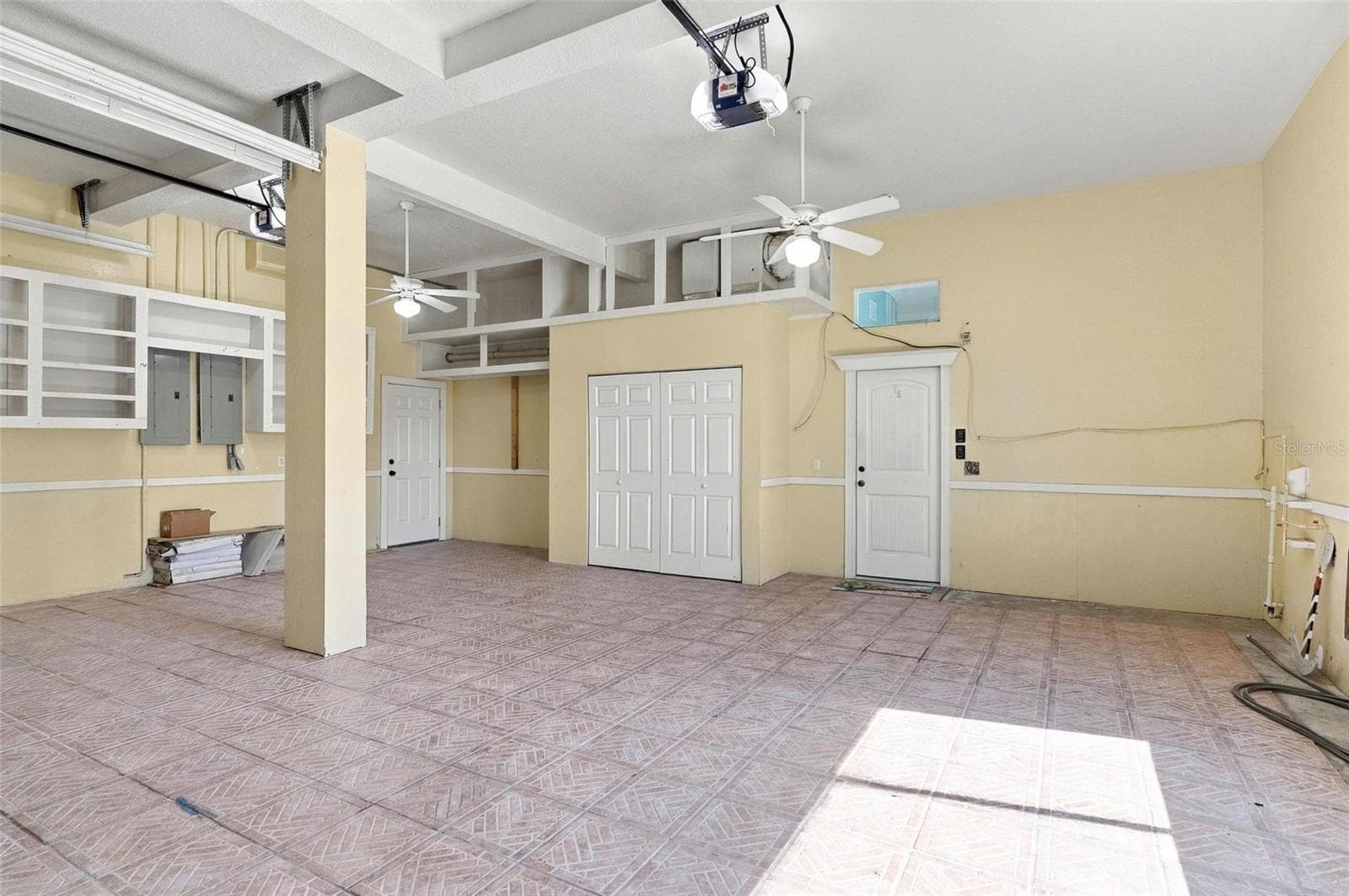 Garage w/ plenty upper storage - 2101 N OCEAN SHORE BLVD, FLAGLER BEACH