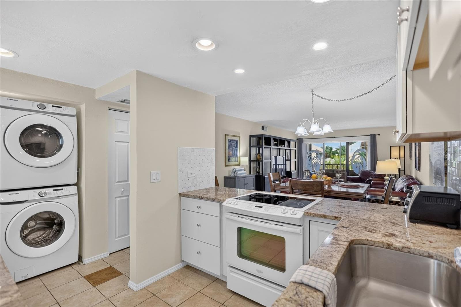 Space saving stacked washer dryer combination. - 6157 MIDNIGHT PASS RD #E53, SARASOTA