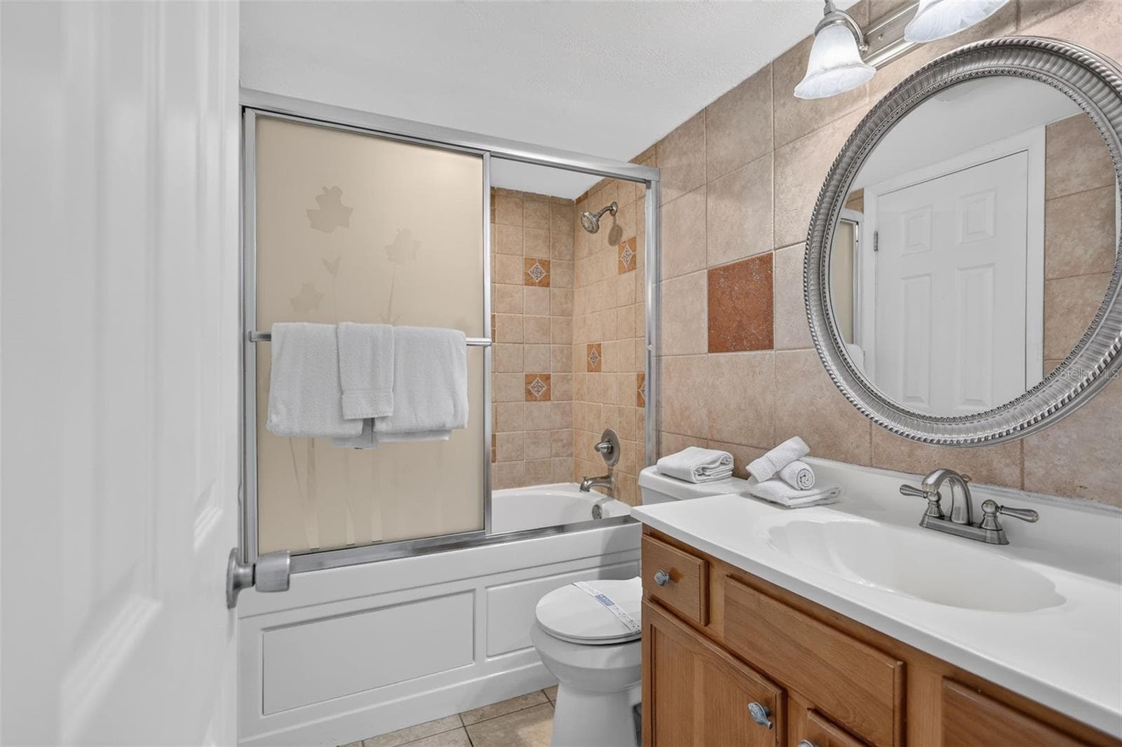 Bathroom features a spacious shower and a luxurious Jacuzzi soaking tub. - 6157 MIDNIGHT PASS RD #E53, SARASOTA