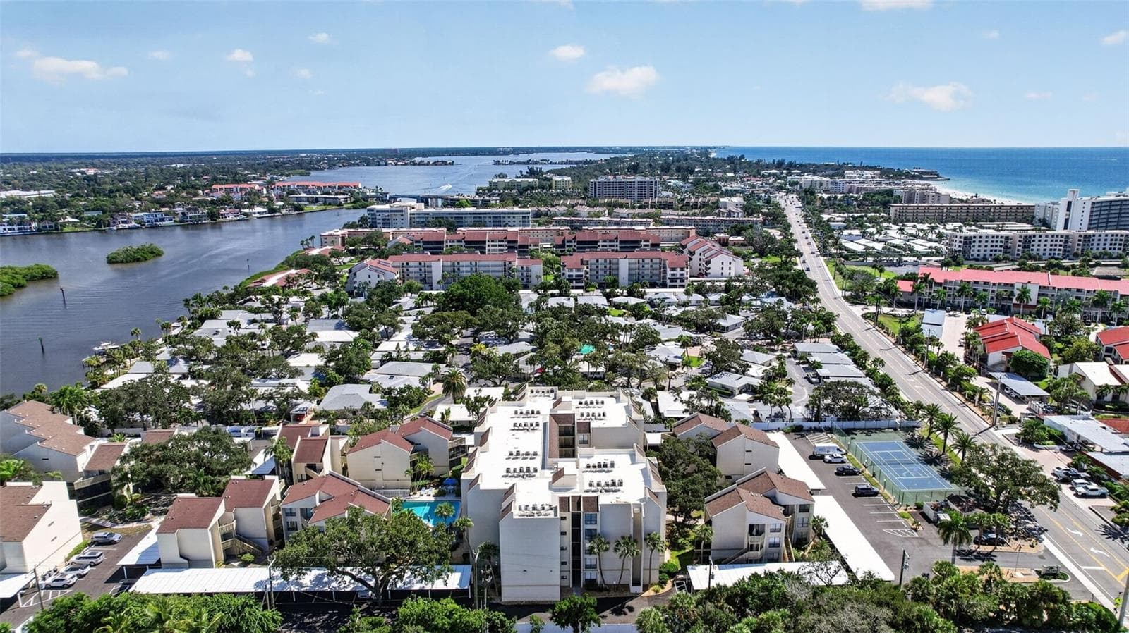Looking South with the intercoastal waterway on the left and the beach on the right. - 6157 MIDNIGHT PASS RD #E53, SARASOTA