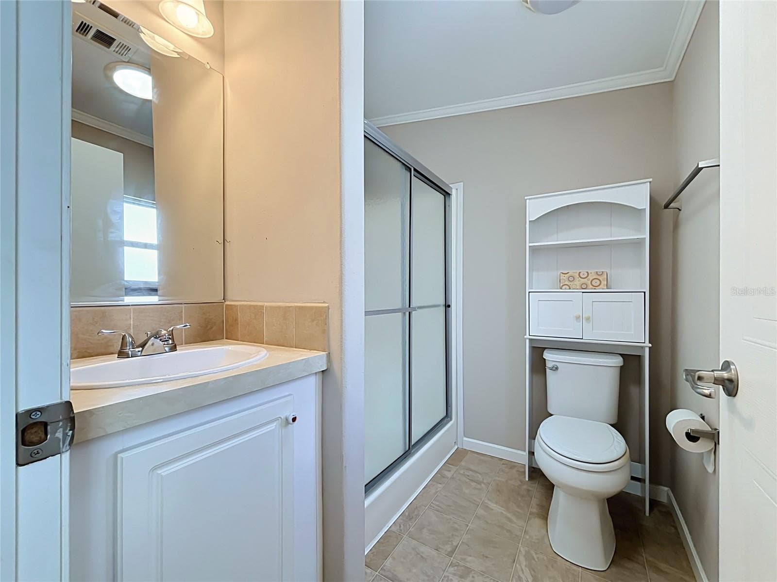 Primary bathroom has walk-in shower and skylight tube allowing natural light to pass through - 9000 US HIGHWAY 192 #181, CLERMONT