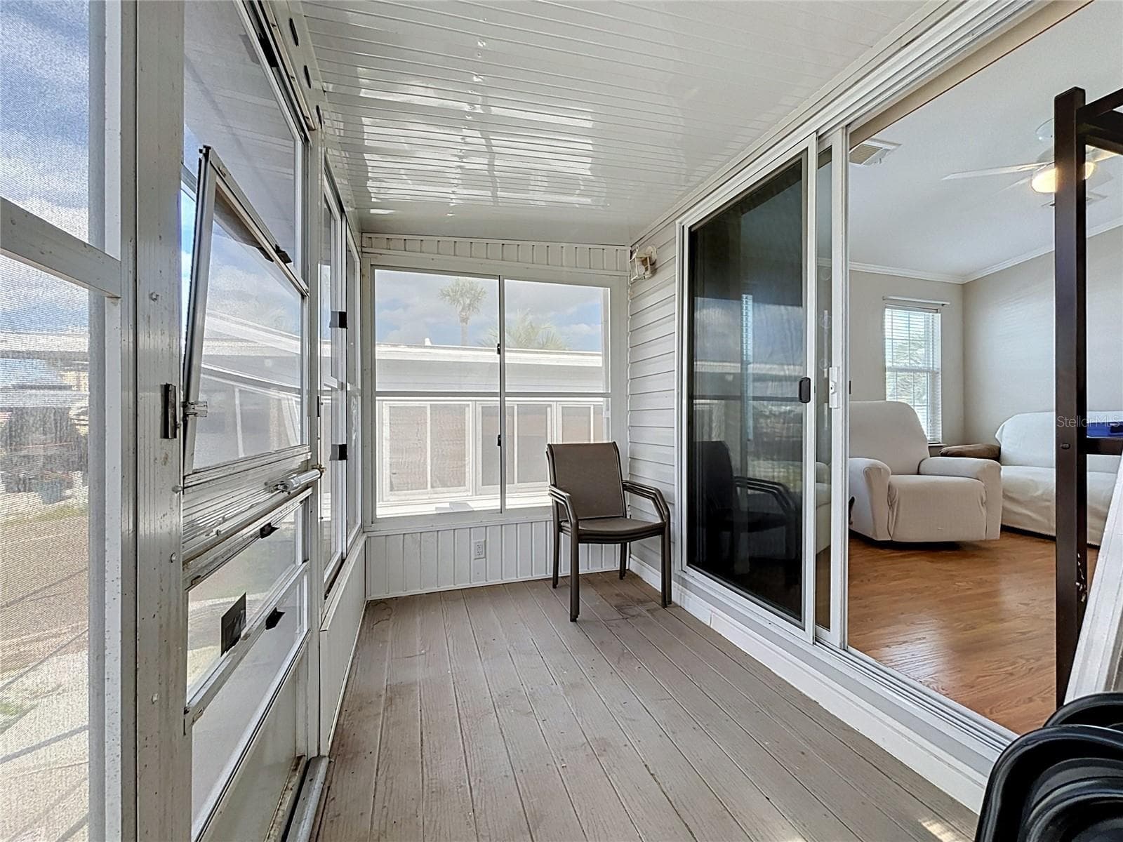 Screened in porch with vinyl windows provides wonderful views of the canal - 9000 US HIGHWAY 192 #181, CLERMONT