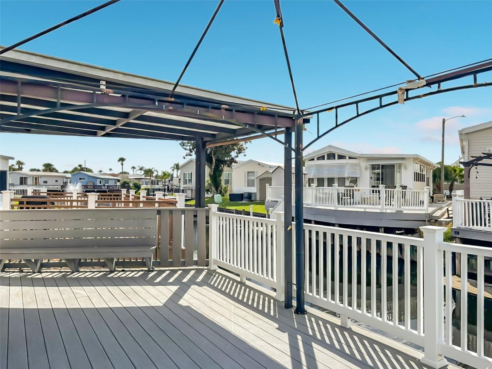 The deck benefits from inbuilt seating on either side as well as covered and open space for all occasions - 9000 US HIGHWAY 192 #181, CLERMONT