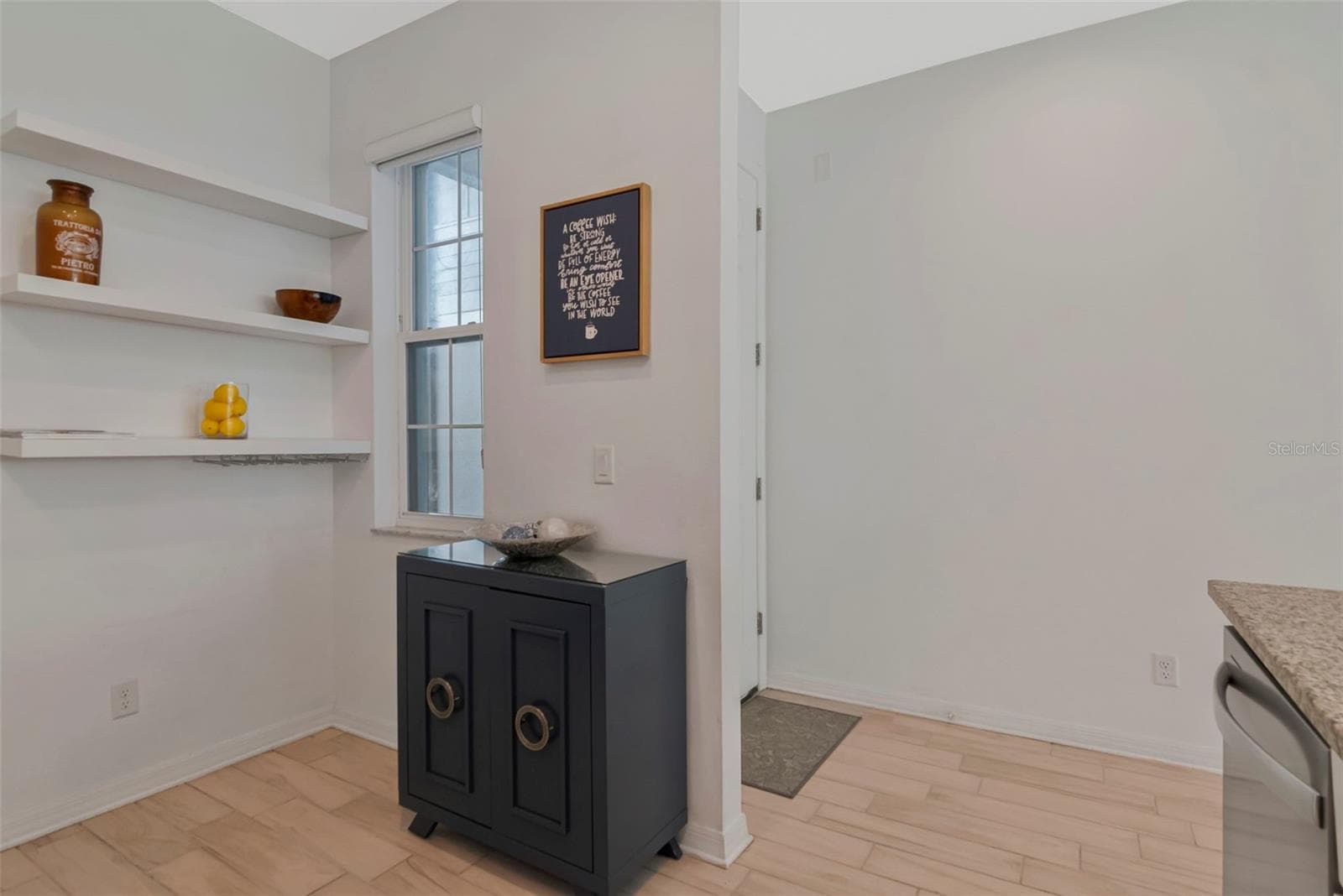 Inviting foyer offering a warm welcome and a seamless transition into the Kitchen and main living area. - 2455 GOLDEN PASTURE CIR, CLEARWATER