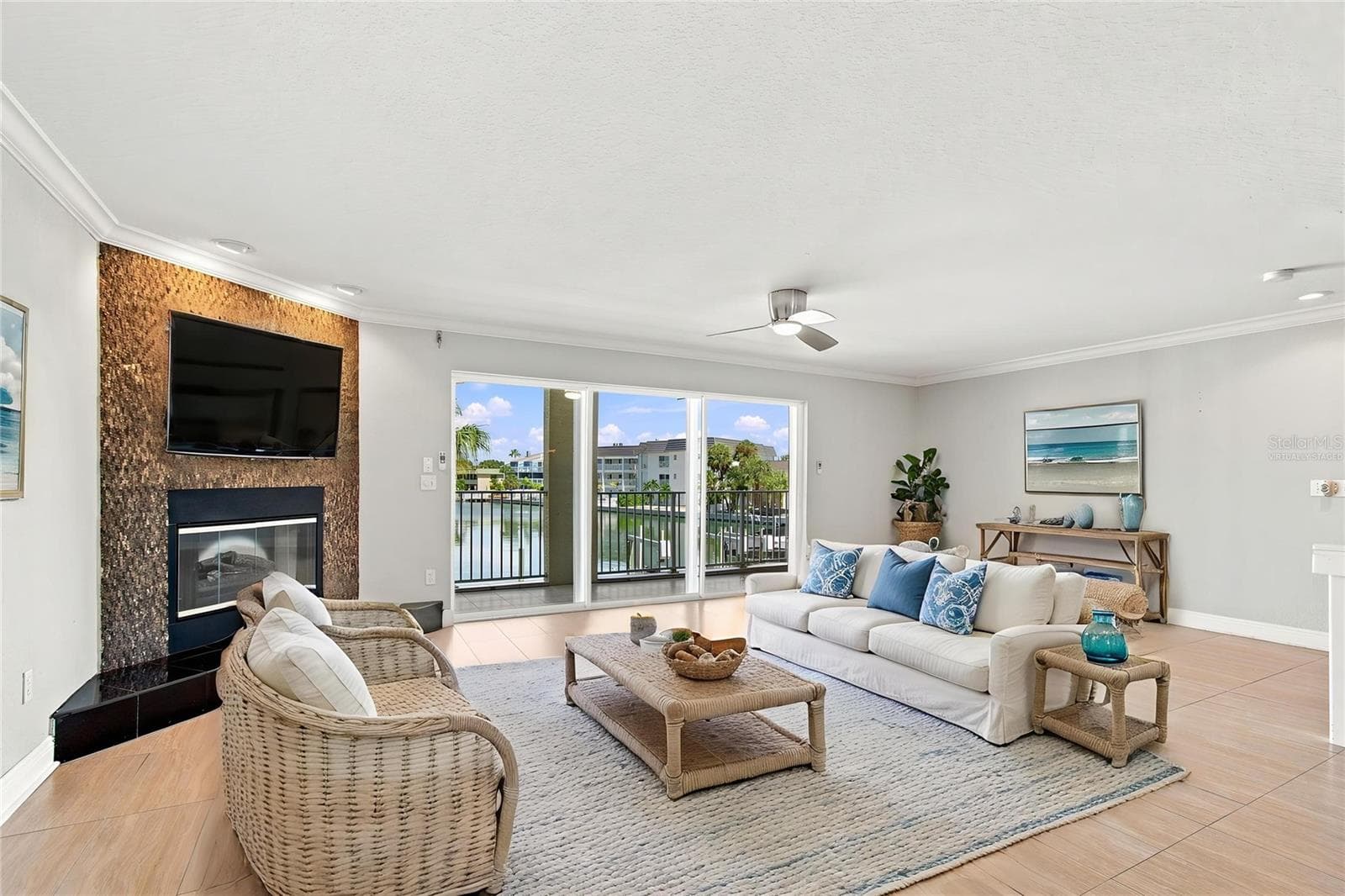 A wood-burning and electric fireplace when you want the ambience, but not the heat. Virtually Staged. - 152 117TH AVE, TREASURE ISLAND