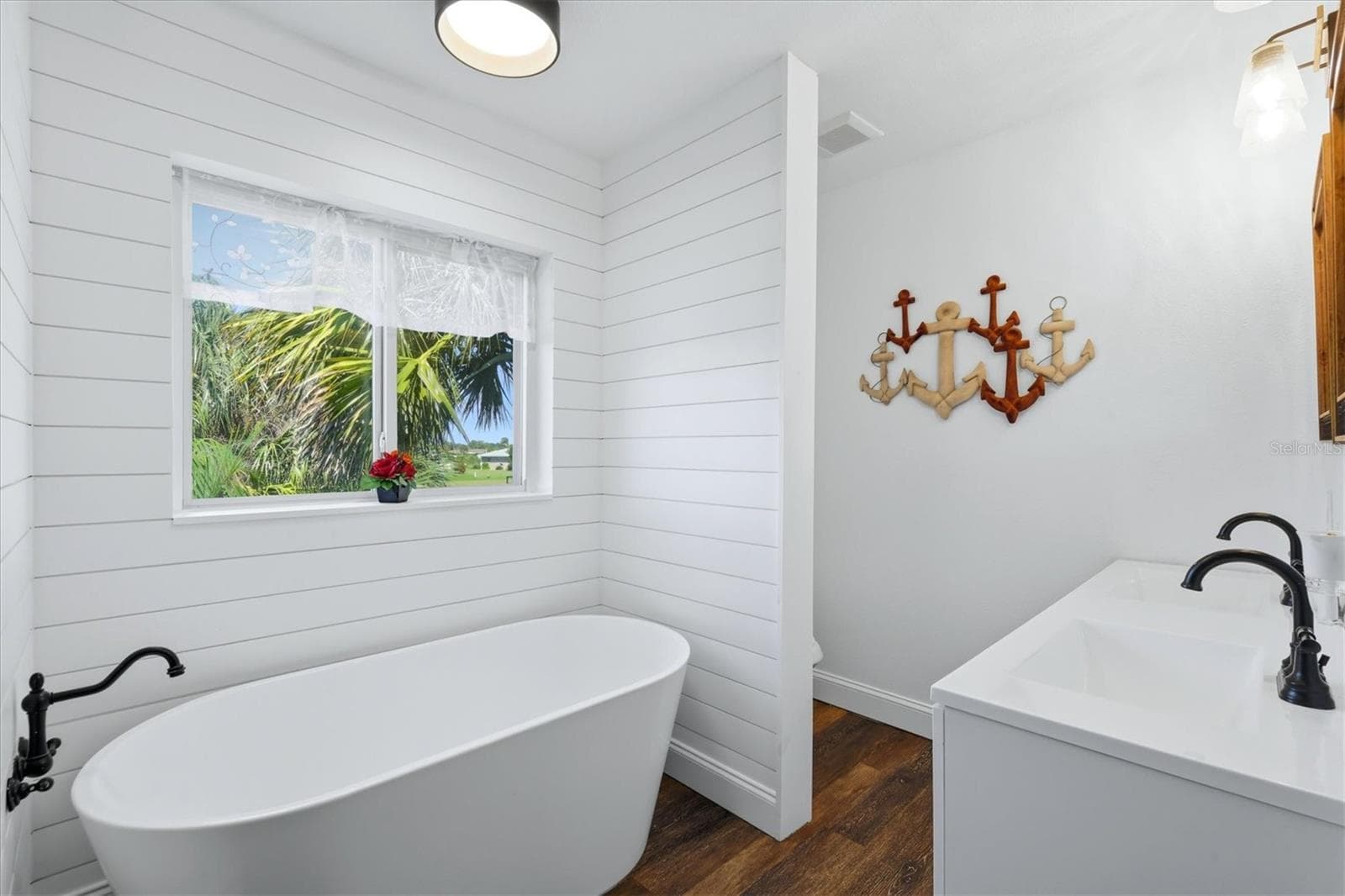 ...with its free-standing soaker tub... - 90 OAKLAND HILLS CT, ROTONDA WEST