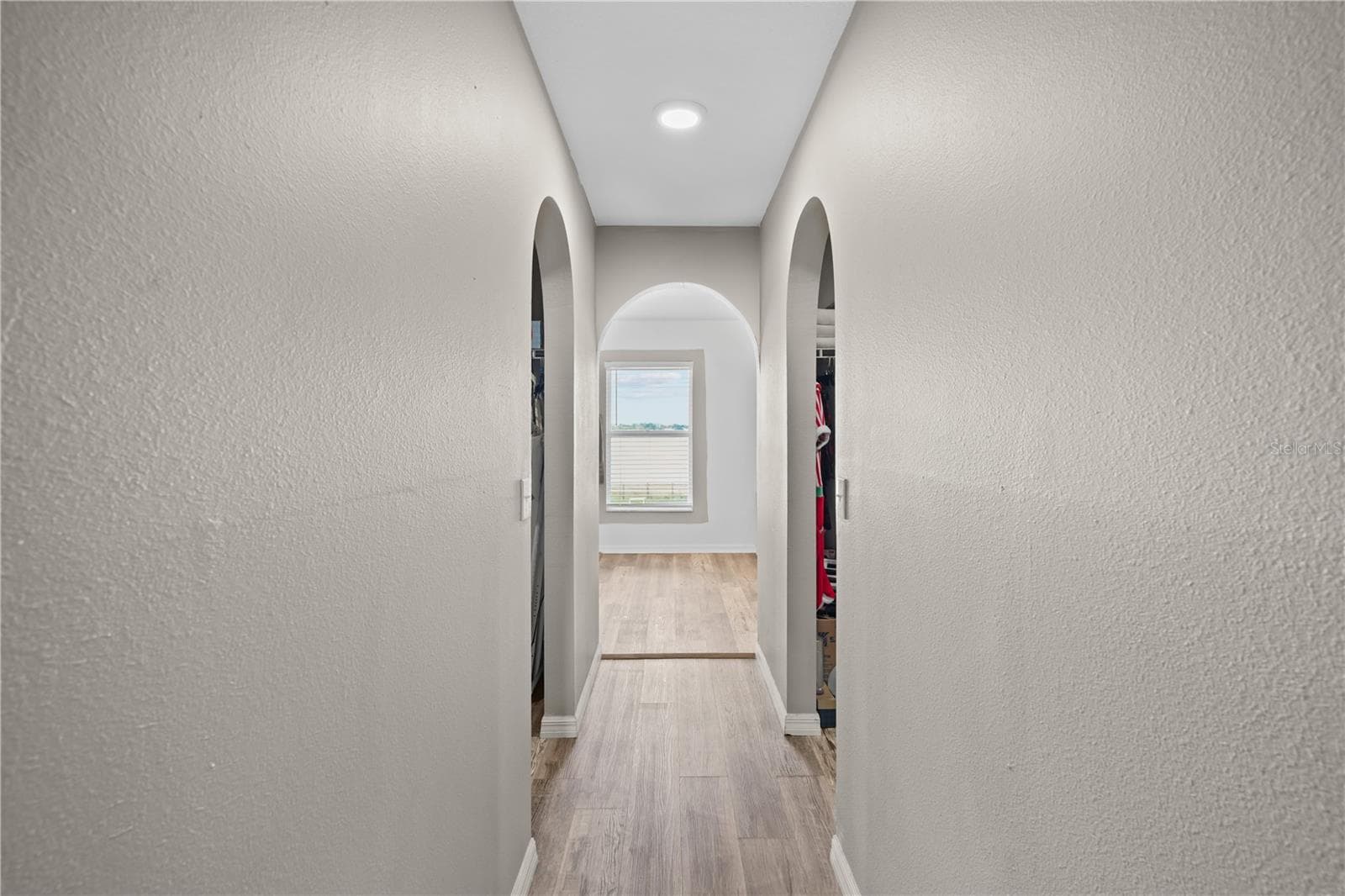 Hallway to primary suite with his and hers walk-in closets - 148 VISTA VIEW AVE, EAGLE LAKE