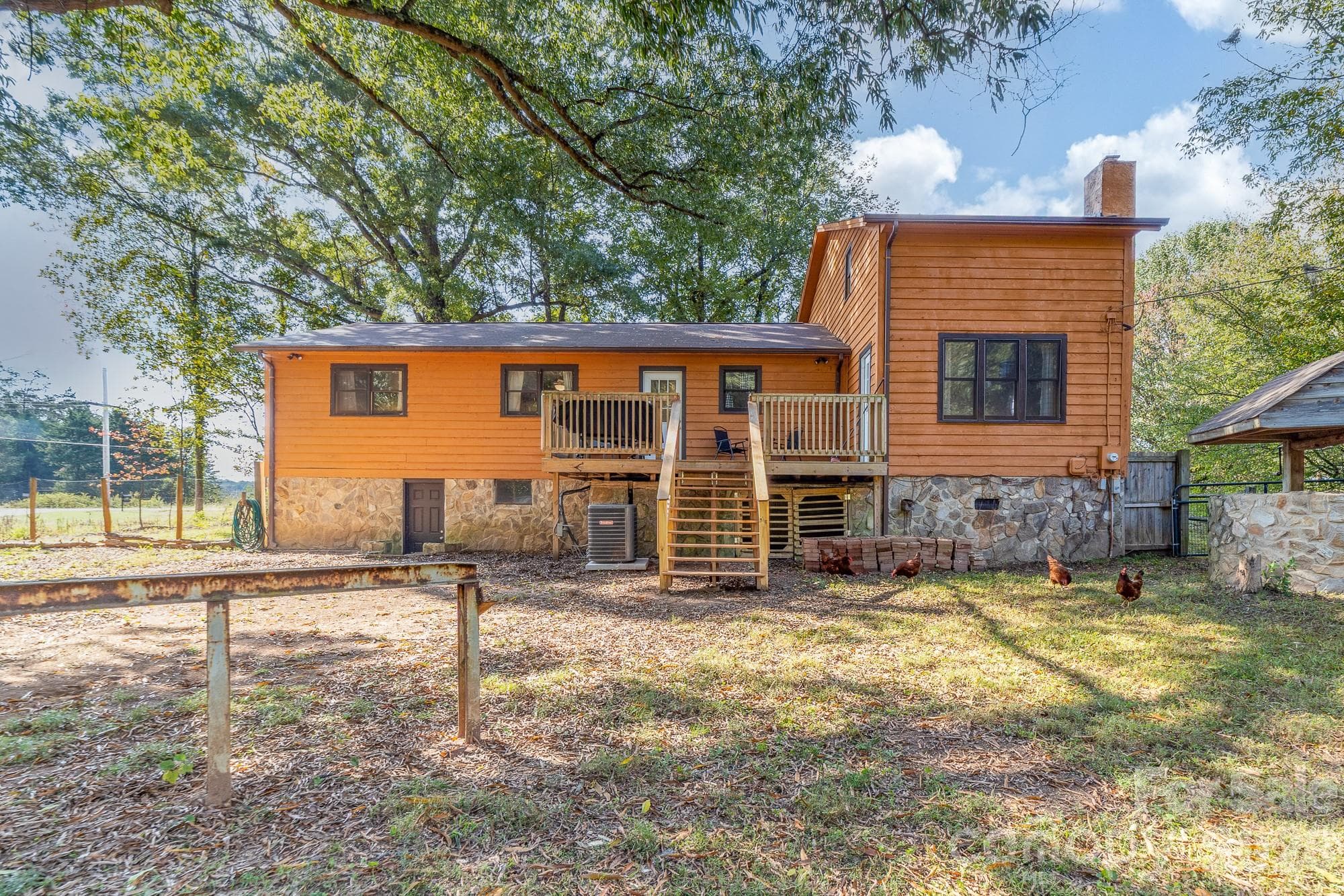 Backyard with view of deck - 233 Third Creek Road, Statesville