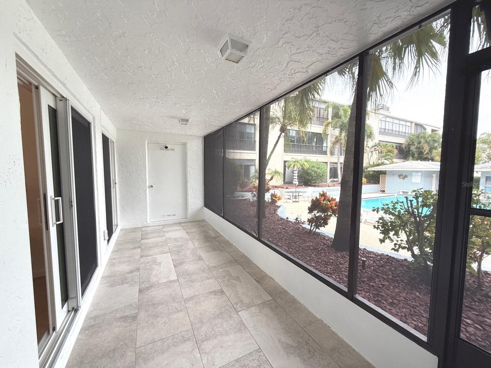 POOL and GARDEN VIEW - 215 VALENCIA BLVD #107, BELLEAIR BLUFFS