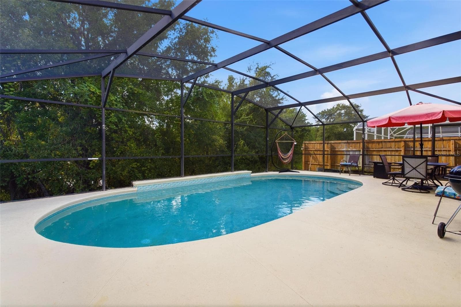 Pool Overlooking Backyard - 945 CLEAR CREEK CIR, CLERMONT